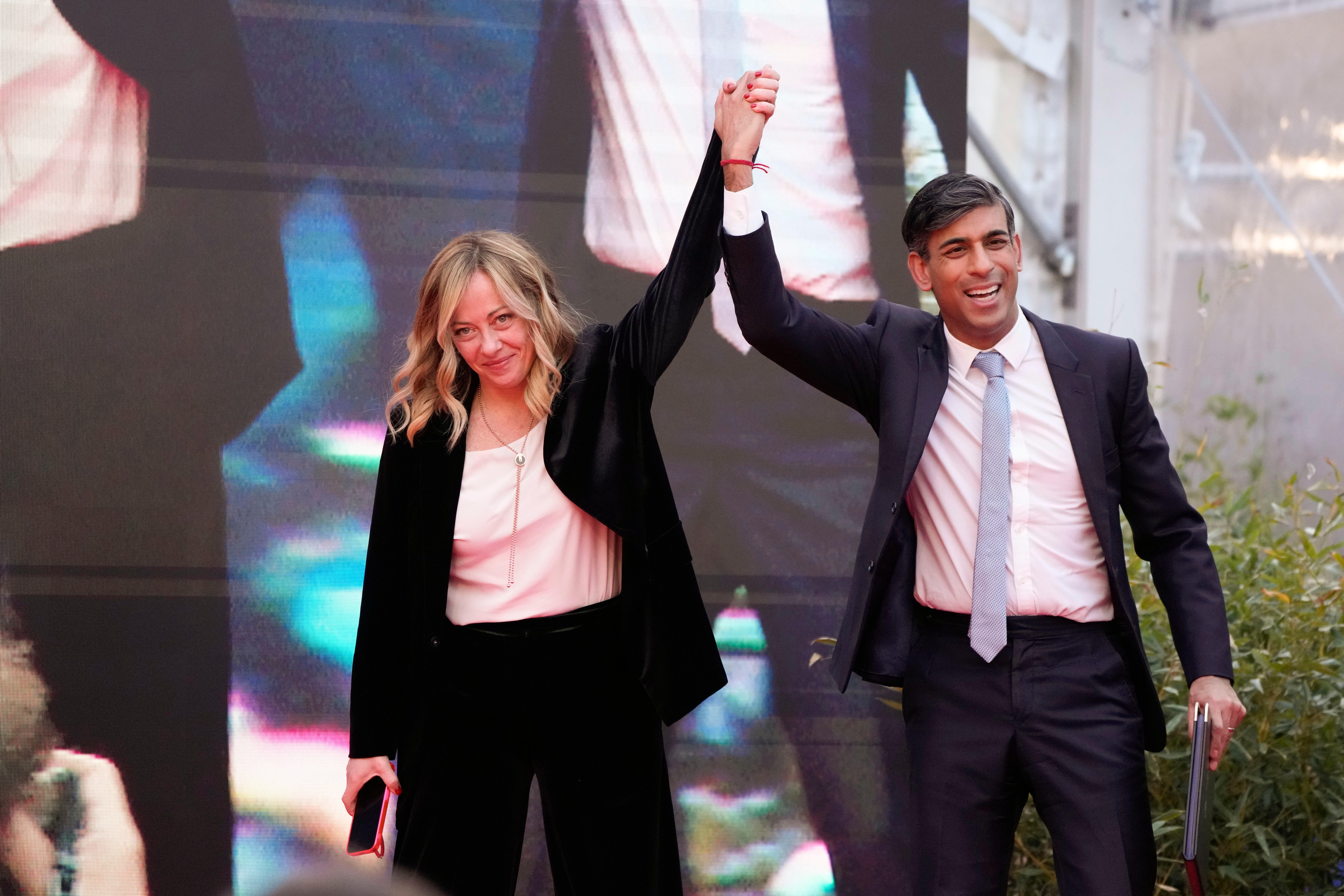 Italy’s prime minister Giorgia Meloni with Rishi Sunak as he finishes his speech in Rome on Saturday