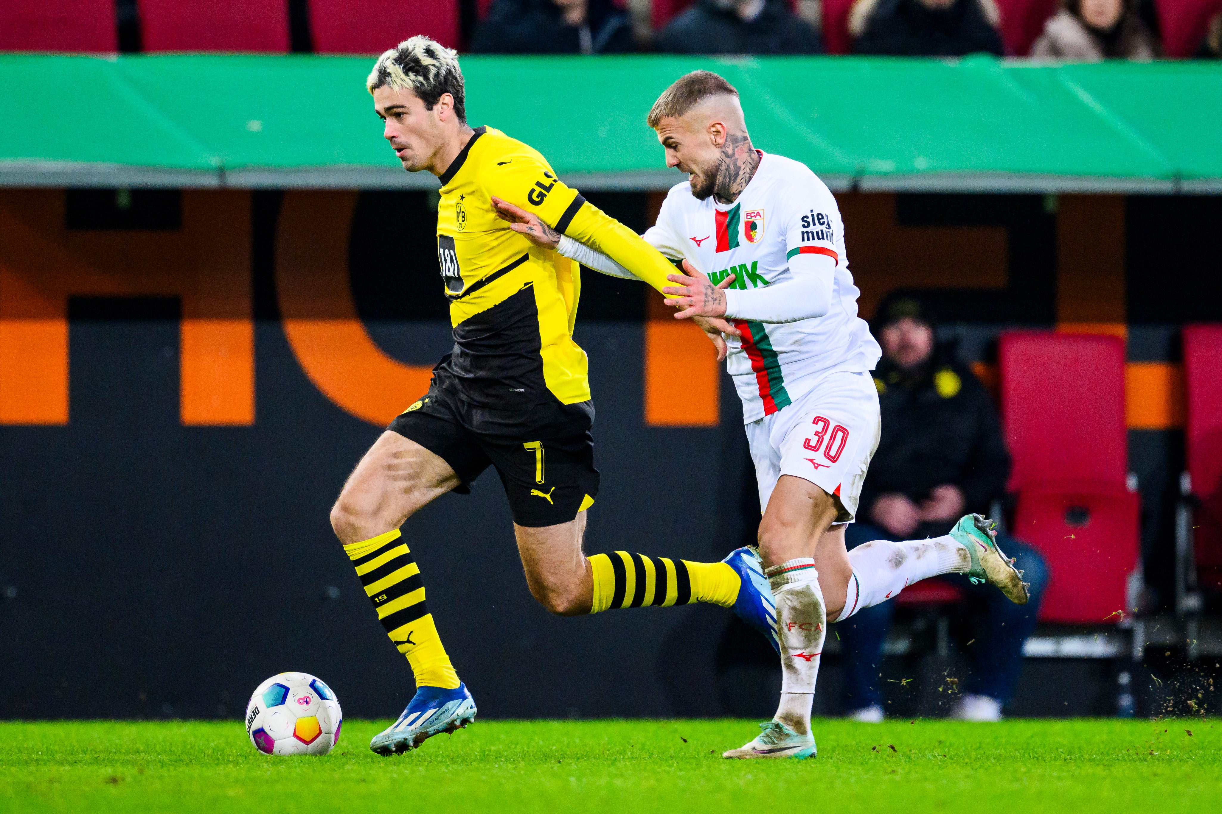 Gio Reyna, left, in action for Borussia Dortmund