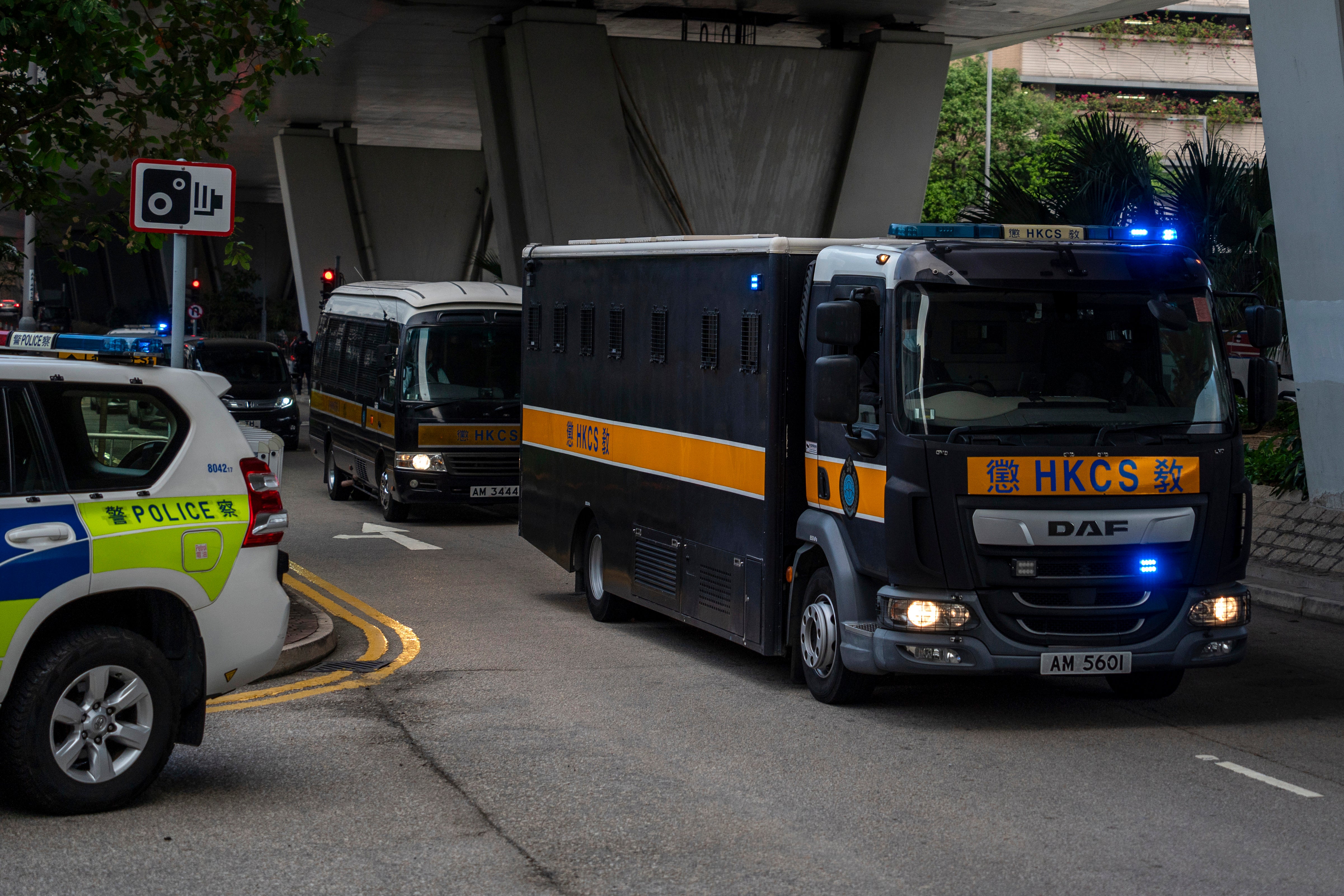 A truck believed to be carrying Jimmy Lai arrives at West Kowloon Magistrates’ Court on Monday. His son said he had no chance of a fair trial