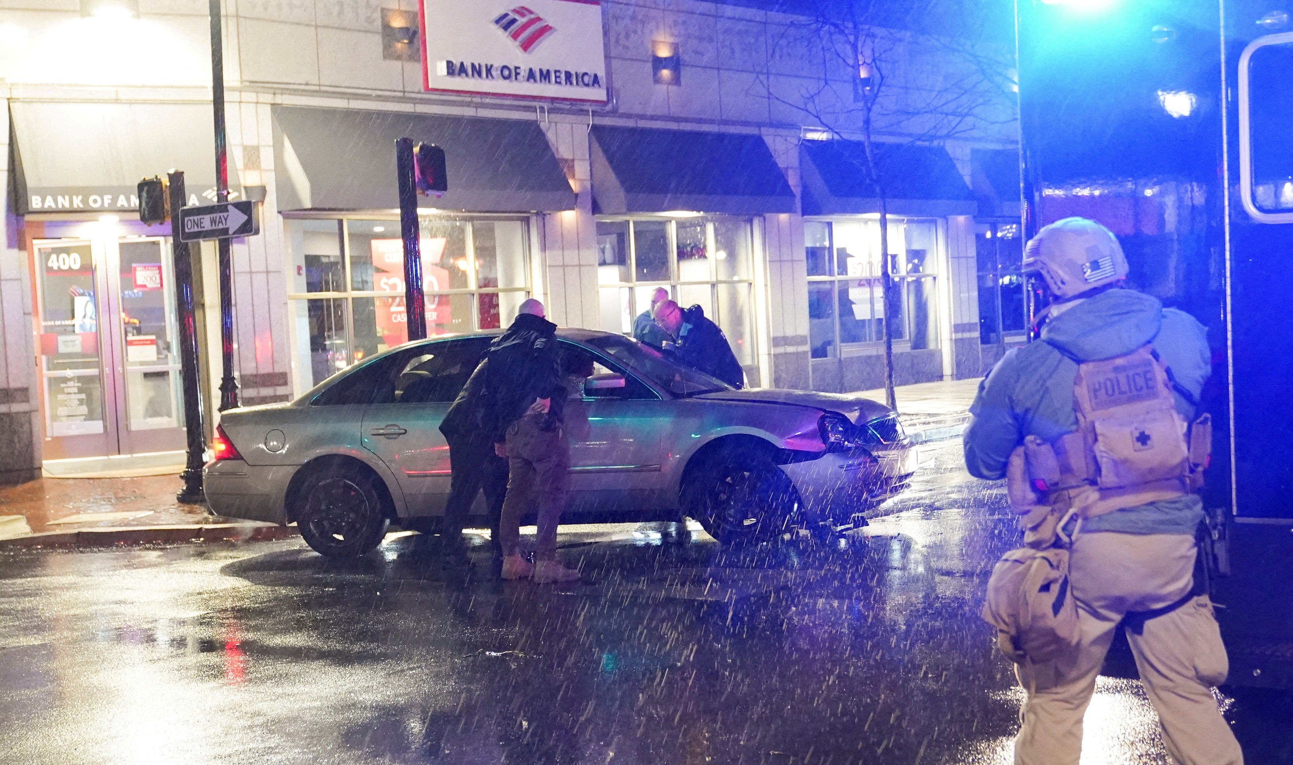 Members of the United States Secret Service react to a vehicle crashing into a Secret Service SUV that was blocking the street, in Wilmington