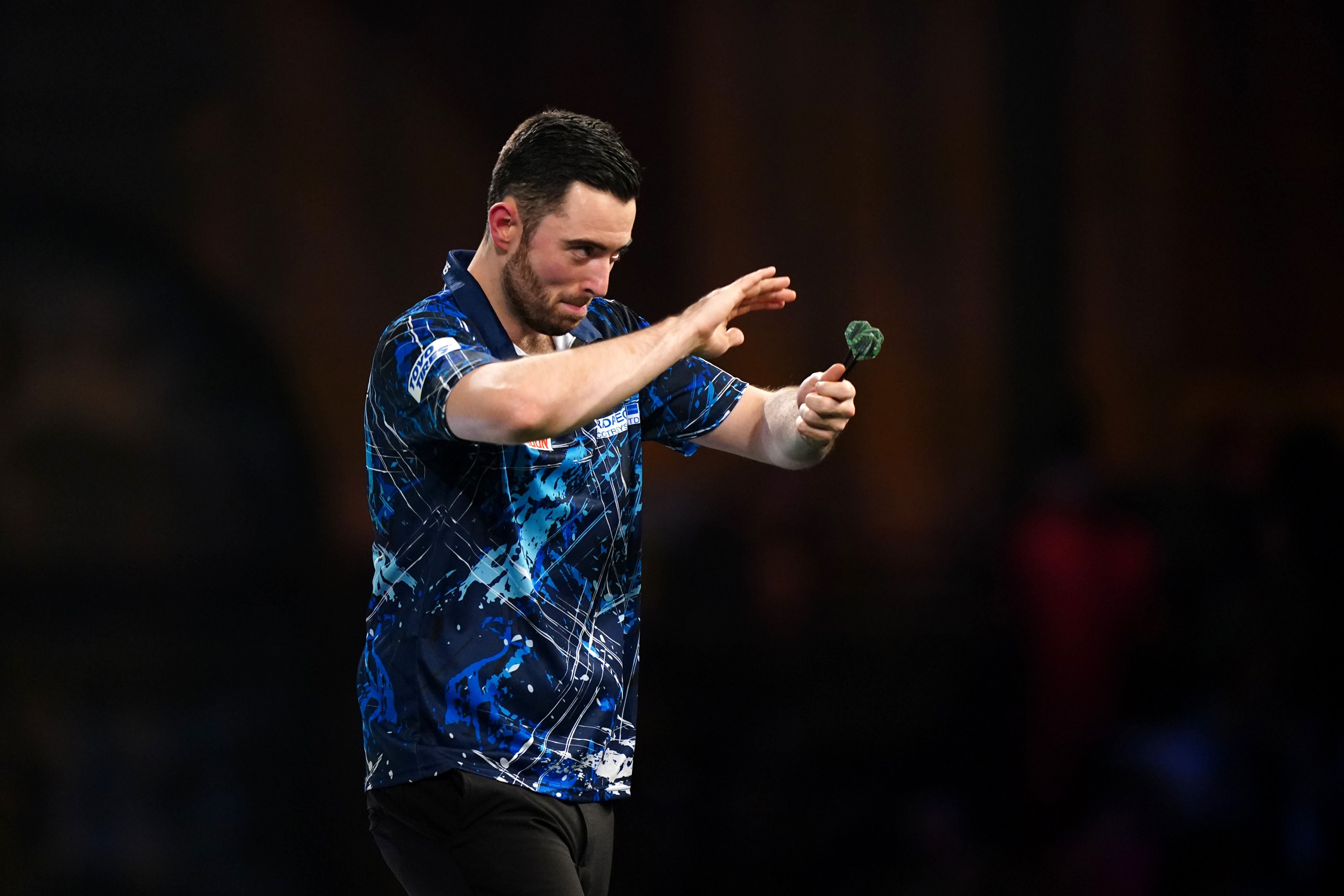 Luke Humphries celebrates victory over Lee Evans (Zac Goodwin/PA)