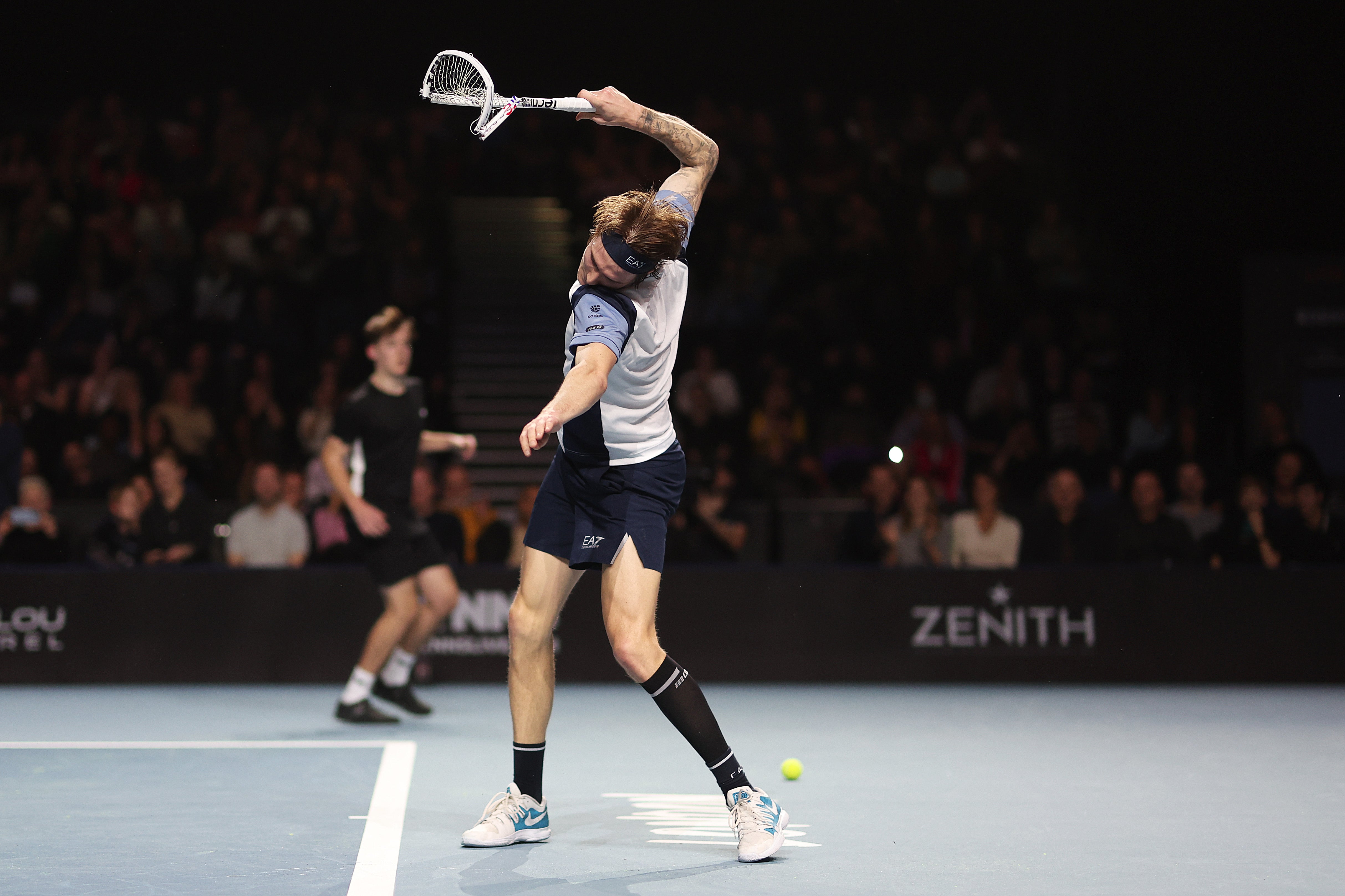 Alexander Bublik smashes up his racquet after a defeat