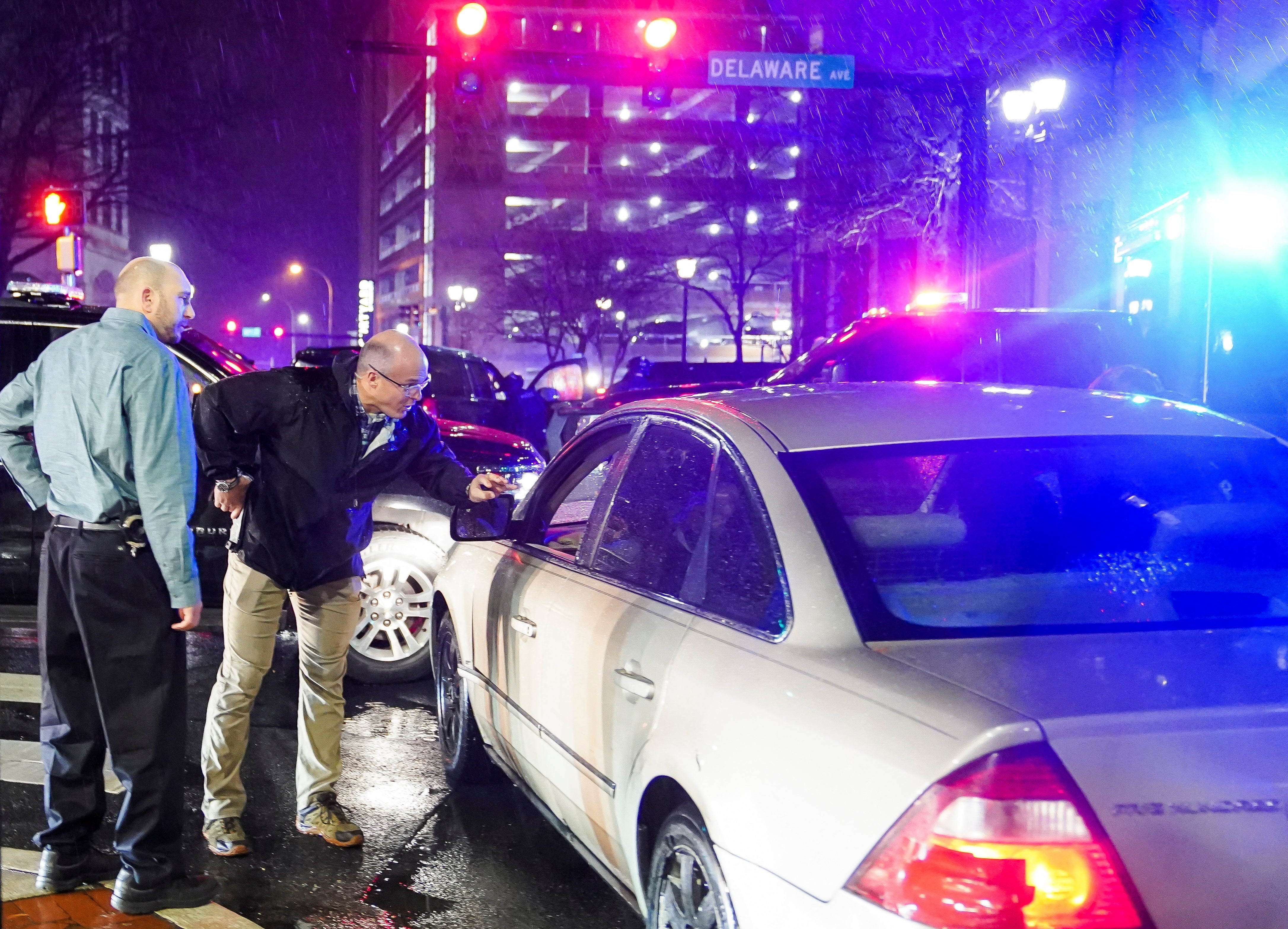 Secret Service agents approach the vehicle