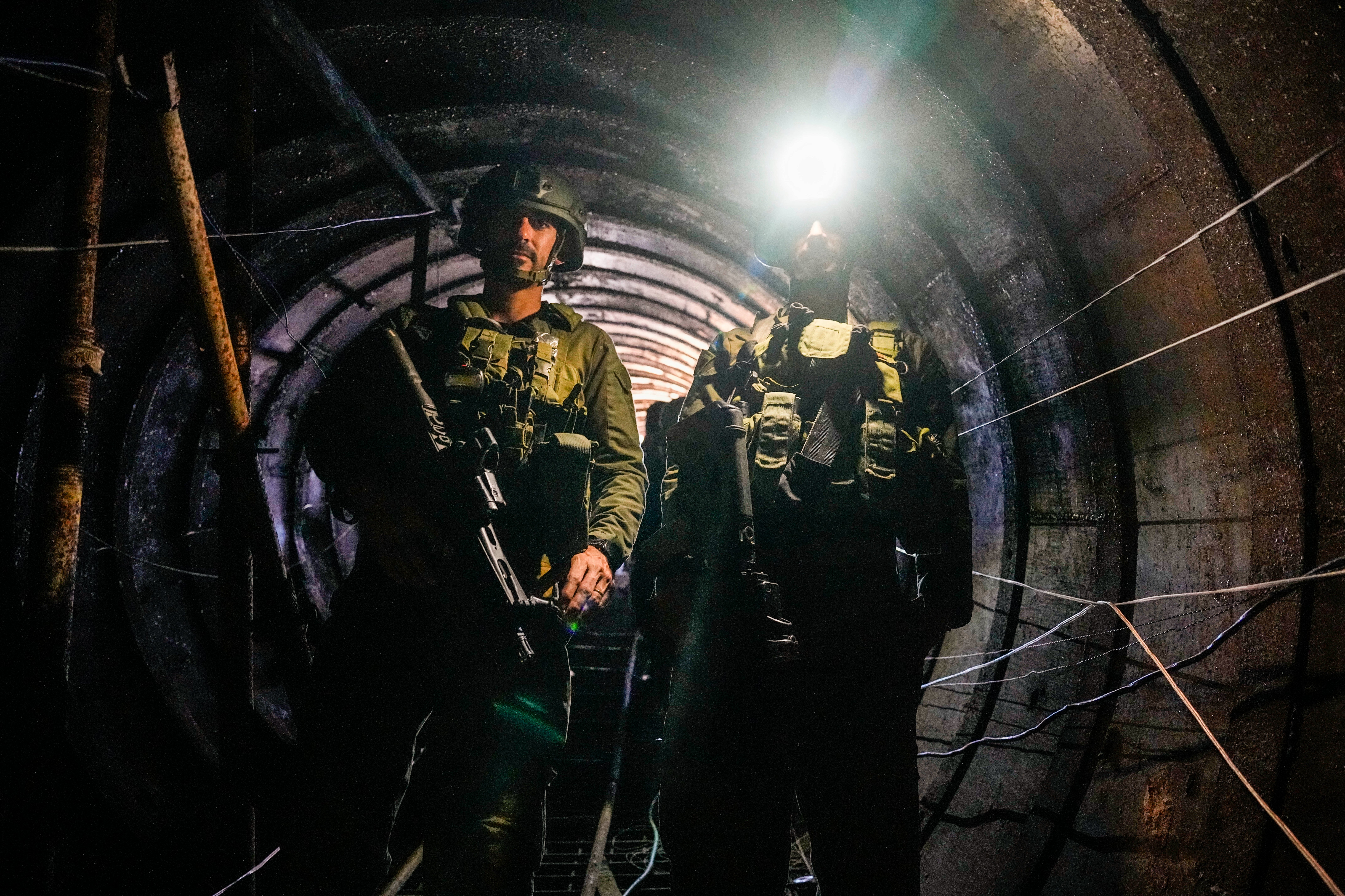 Israeli soldiers are seen in a tunnel that the military says Hamas militants used to attack the Erez crossing in the northern Gaza Strip