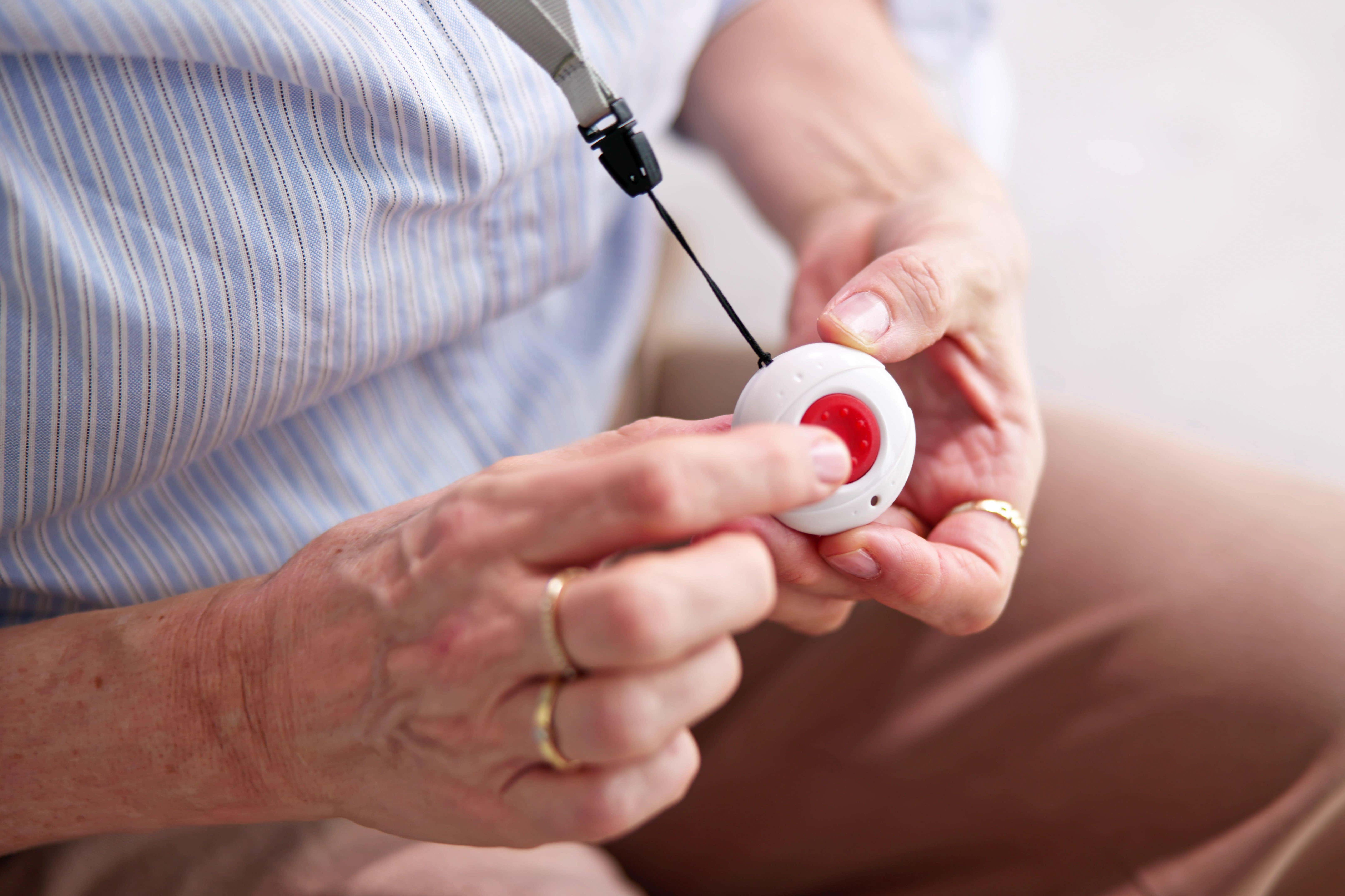 Personal alarm buttons are usually worn around the neck or on the wrist (Alamy/PA)