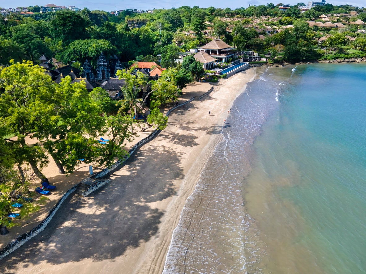 A white crescent of sand in the south, Jimbaran sparkles under the Balinese sun