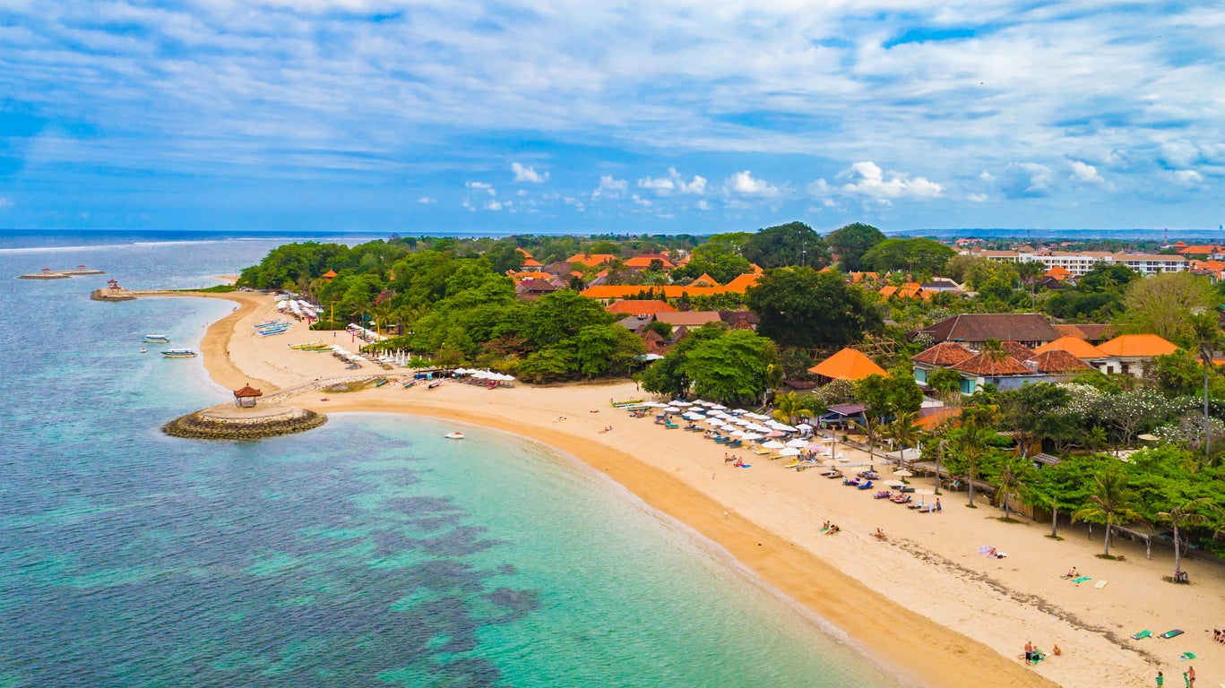 Five miles of golden sand stretch the south east on Sanur’s calm beach