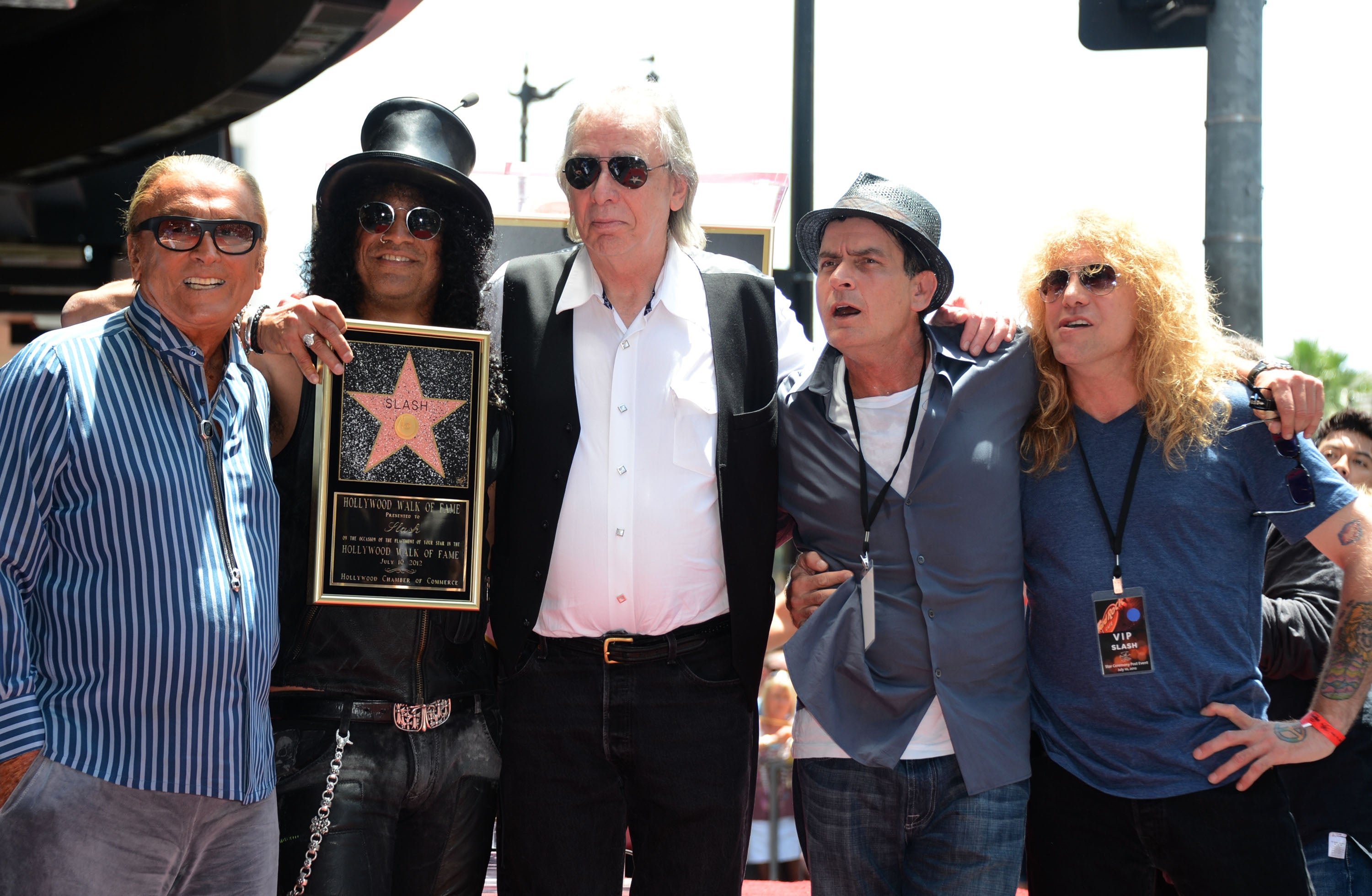 Jim Ladd (centre) with Slash (second from left) who was honoured with a Star on the Hollywood Walk of Fame in 2012. Also pictured: producer Robert Evans, actor Charlie Sheen and Steven Adler