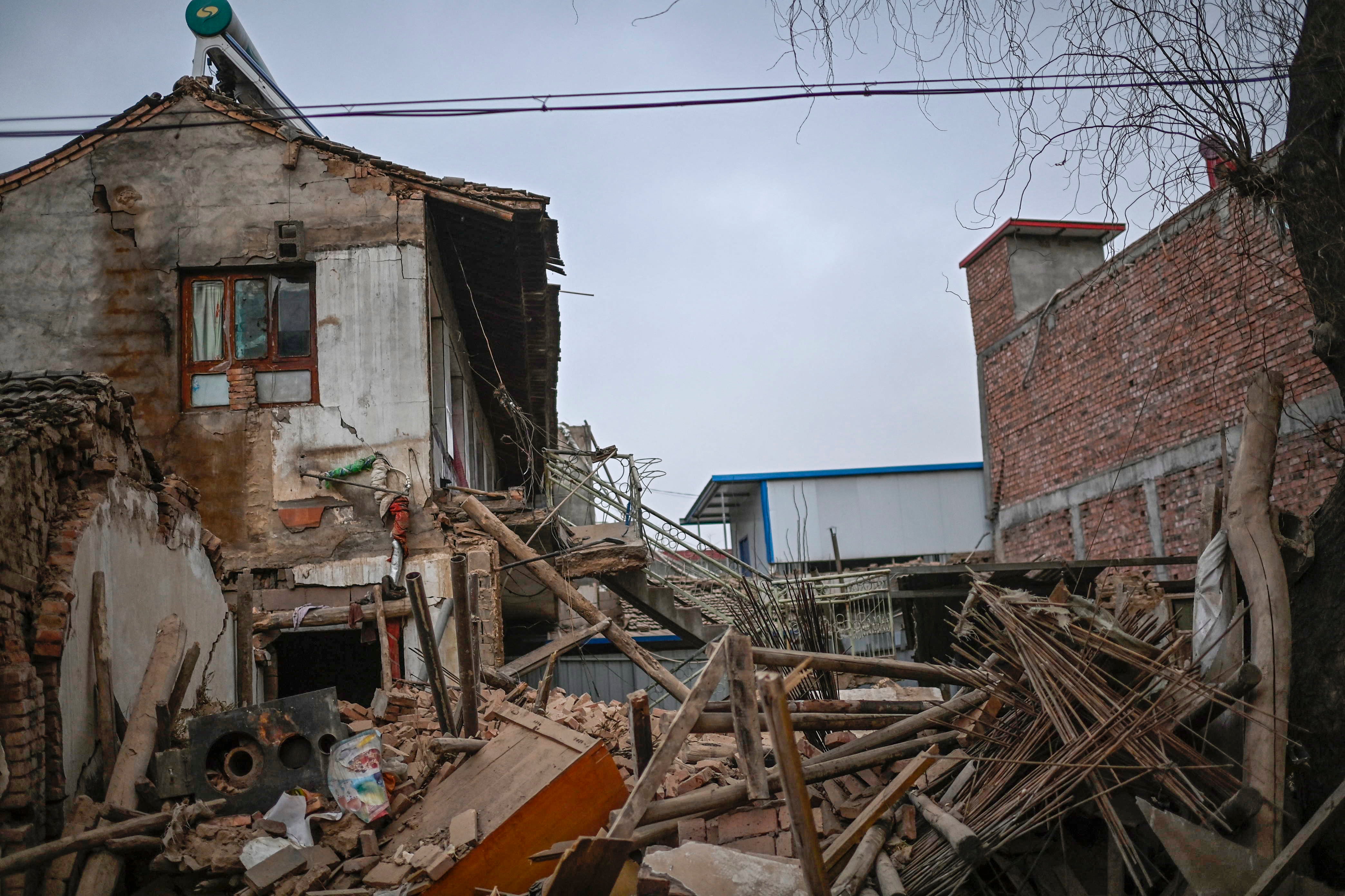 A general view shows a collapsed building after an earthquake in Dahejia, Jishishan County