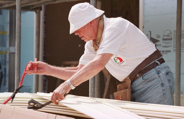 Former president Jimmy Carter works on August 6, 2001 at a construction site sponsored by the Jimmy Carter Work Project 2001 in Asan, about 60 miles south of Seoul, South Korea