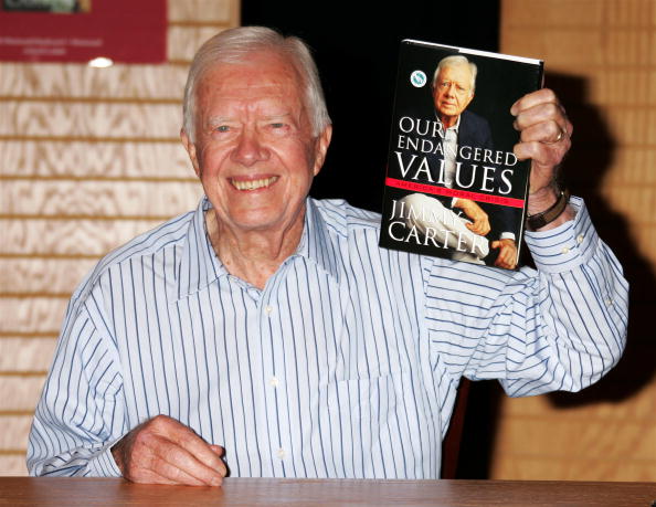 Former president Jimmy Carter displays his new book, ‘Our Endangered Values’, during a signing at Borders Westwood on November 21, 2005, in Westwood, California