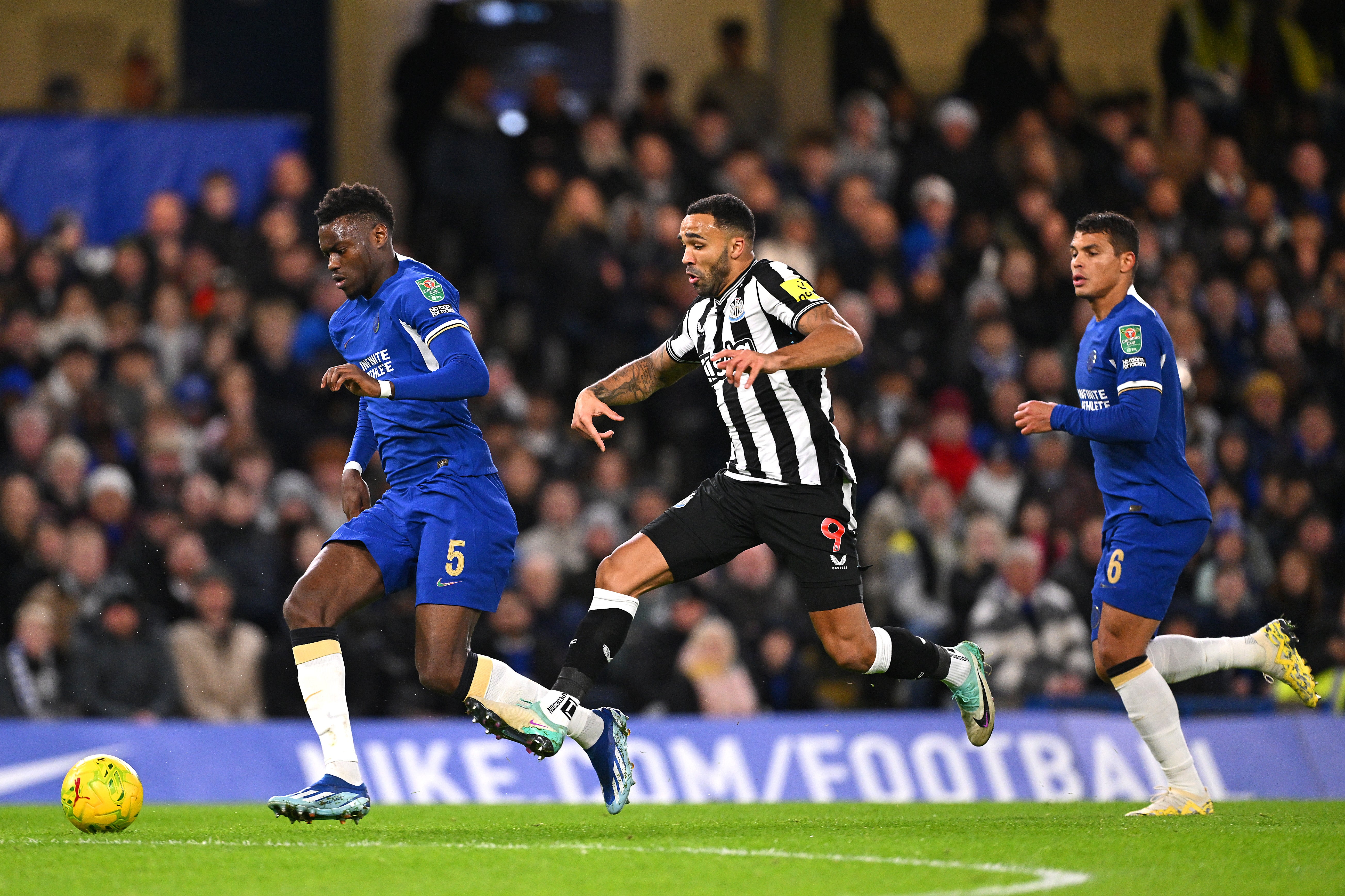 Benoit Badiashile of Chelsea is challenged by Callum Wilson of Newcastle United