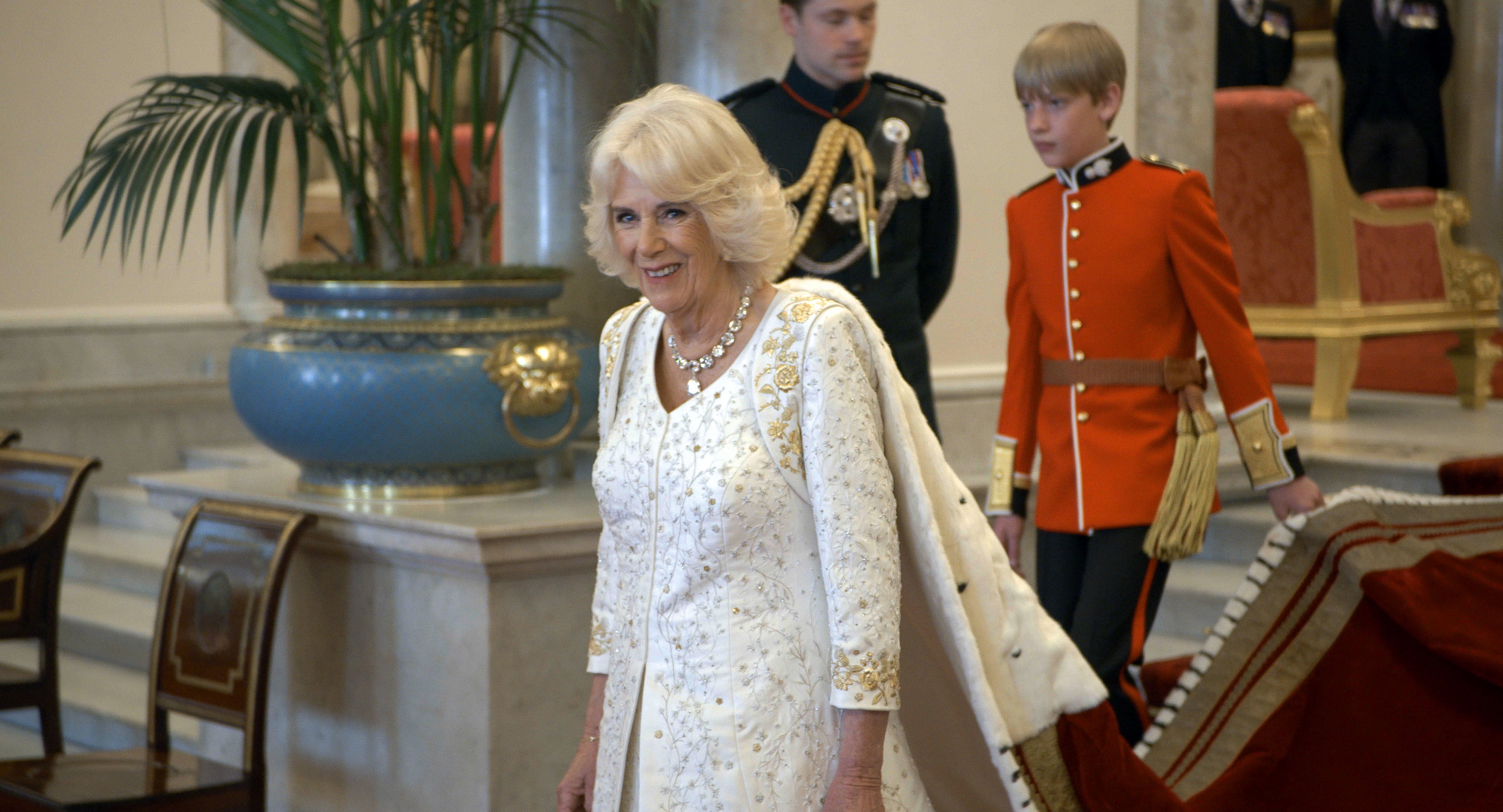 Queen Camilla smiles for the behind-the-scenes camera on coronation day