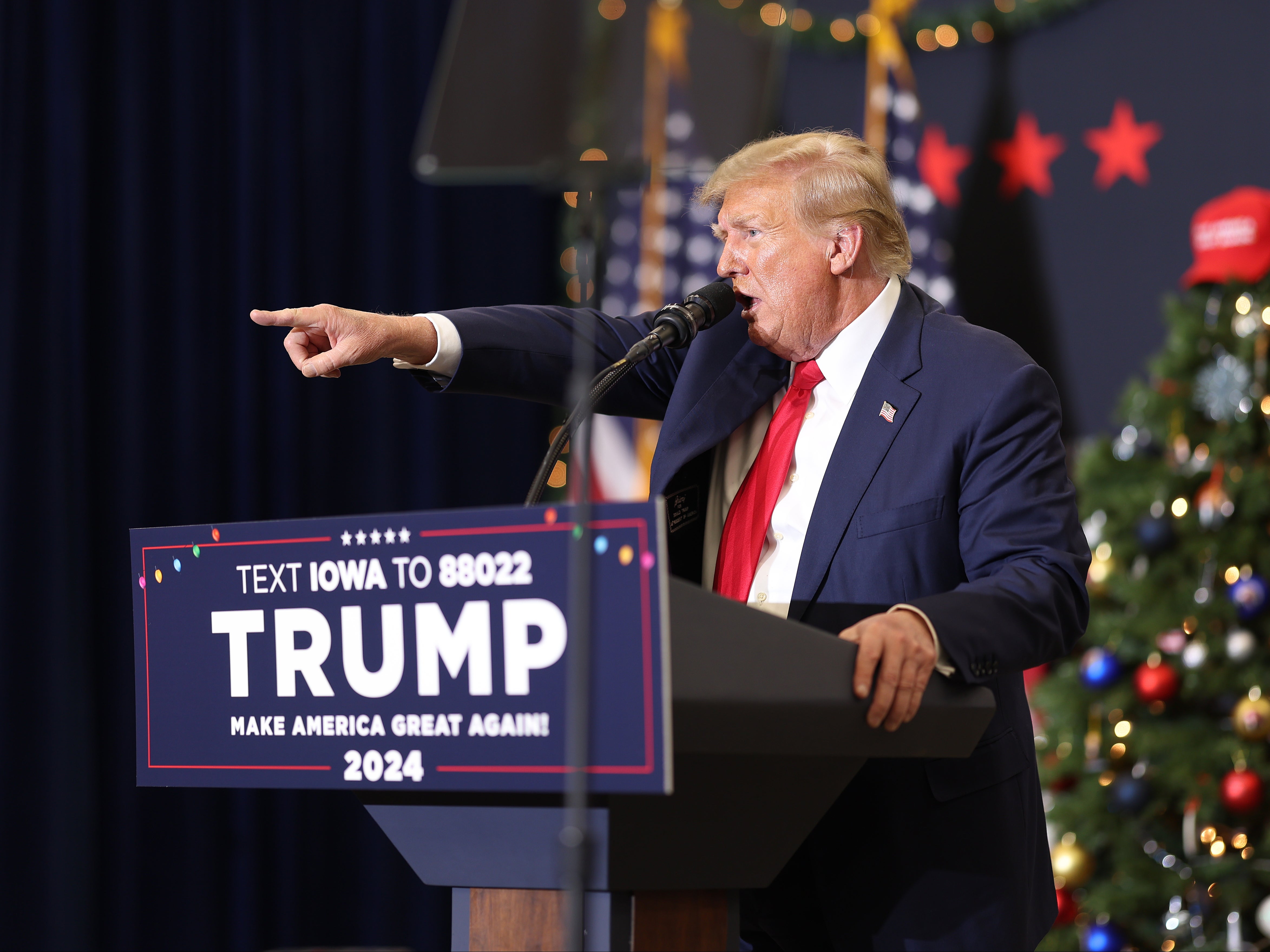 Former US president Donald Trump address a rally crowd in Waterloo, Iowa, on 19 December 2023