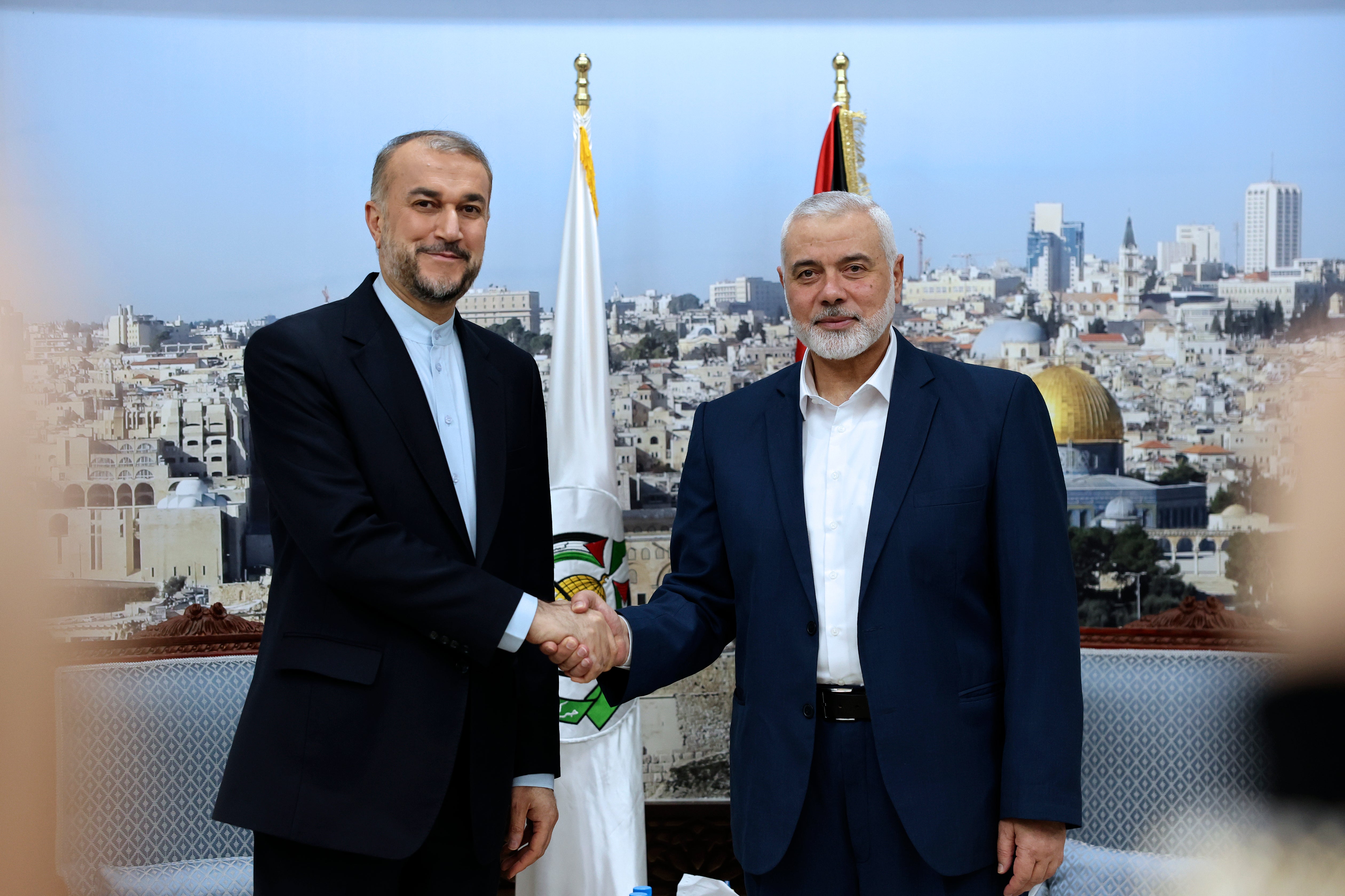 Iran’s foreign minister Hossein Amir-Abdollahian (left) shakes hands with Hamas chief Ismail Haniyeh, during a meeting in Doha, Qatar