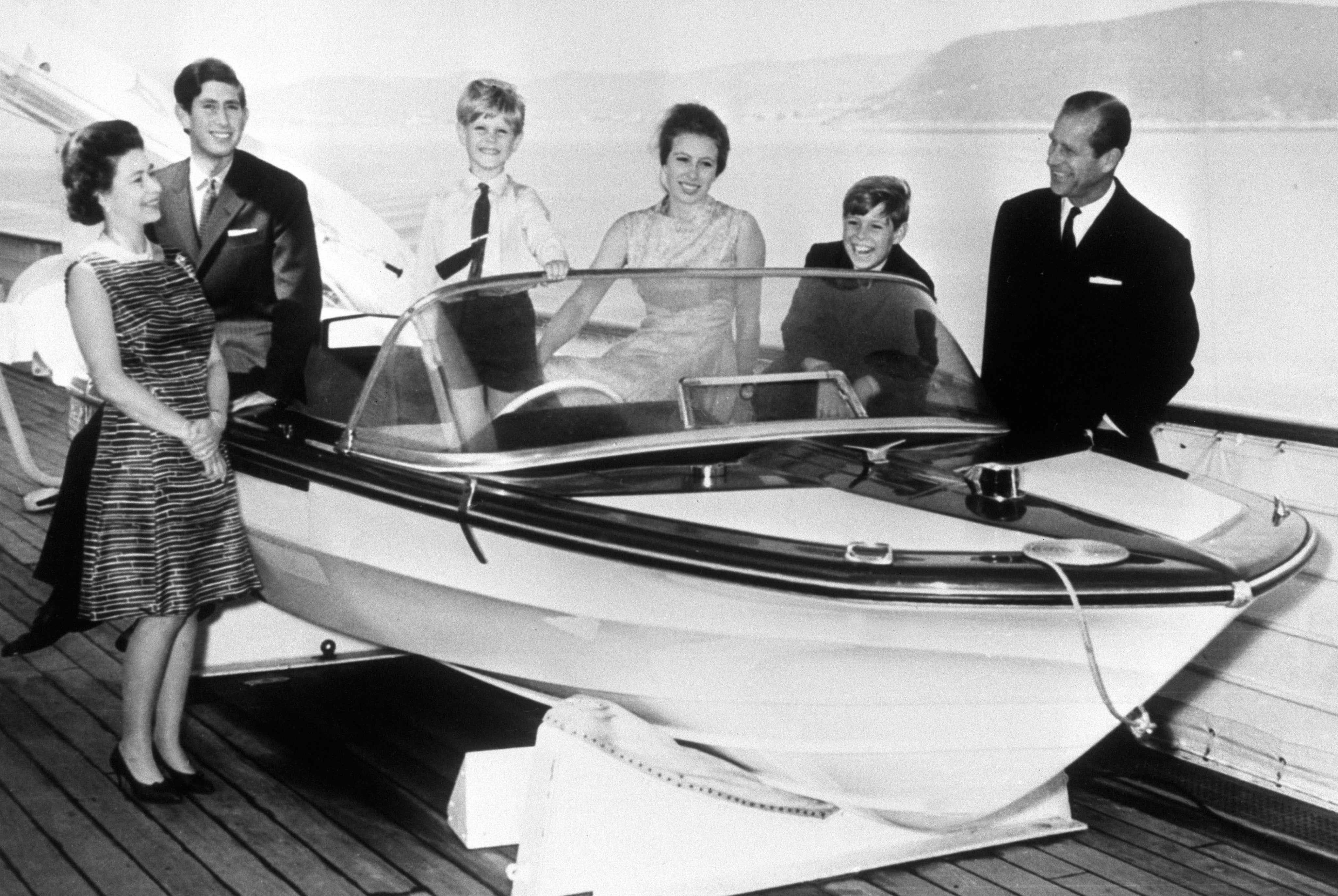 Queen Elizabeth II, the Prince of Wales, Prince Edward, Princess Anne, Prince Andrew and the Duke of Edinburgh on board the Royal Yacht Britannia during a visit to Norway. It is the photograph used on the Queen's personal Christmas card.