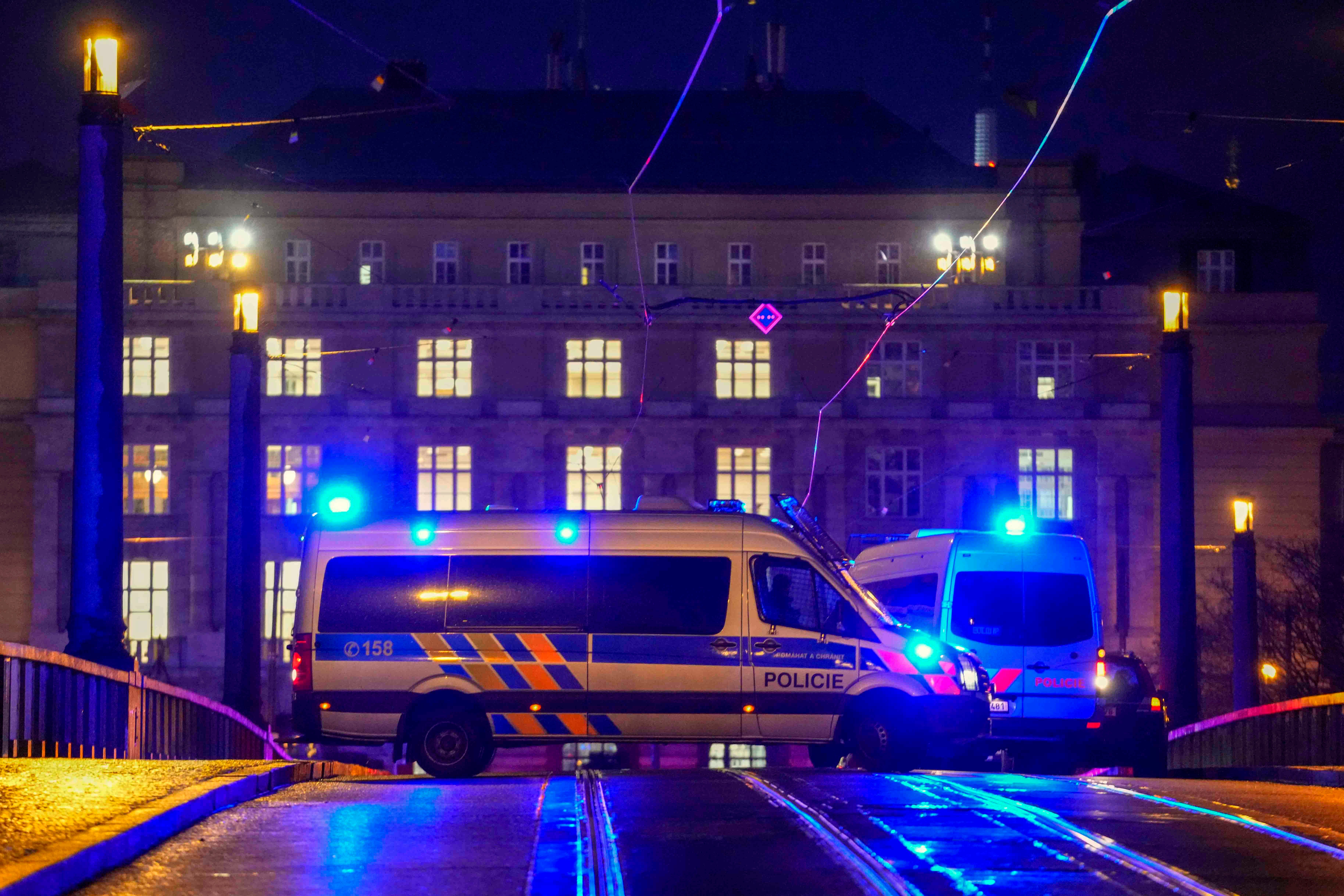 Police officers in a van secure the area in Prague