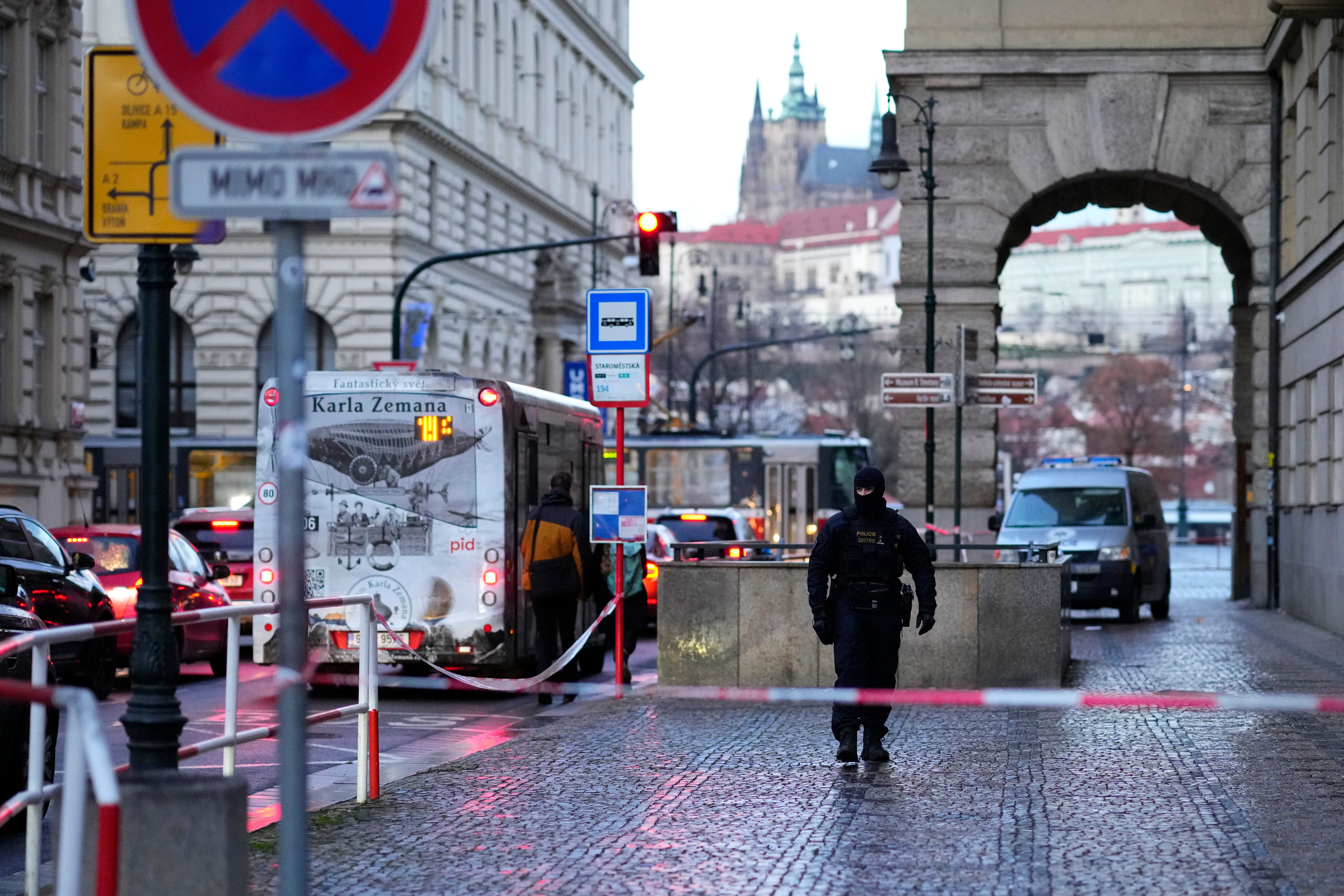 A policeman guards the area outside the building of Philosophical Faculty