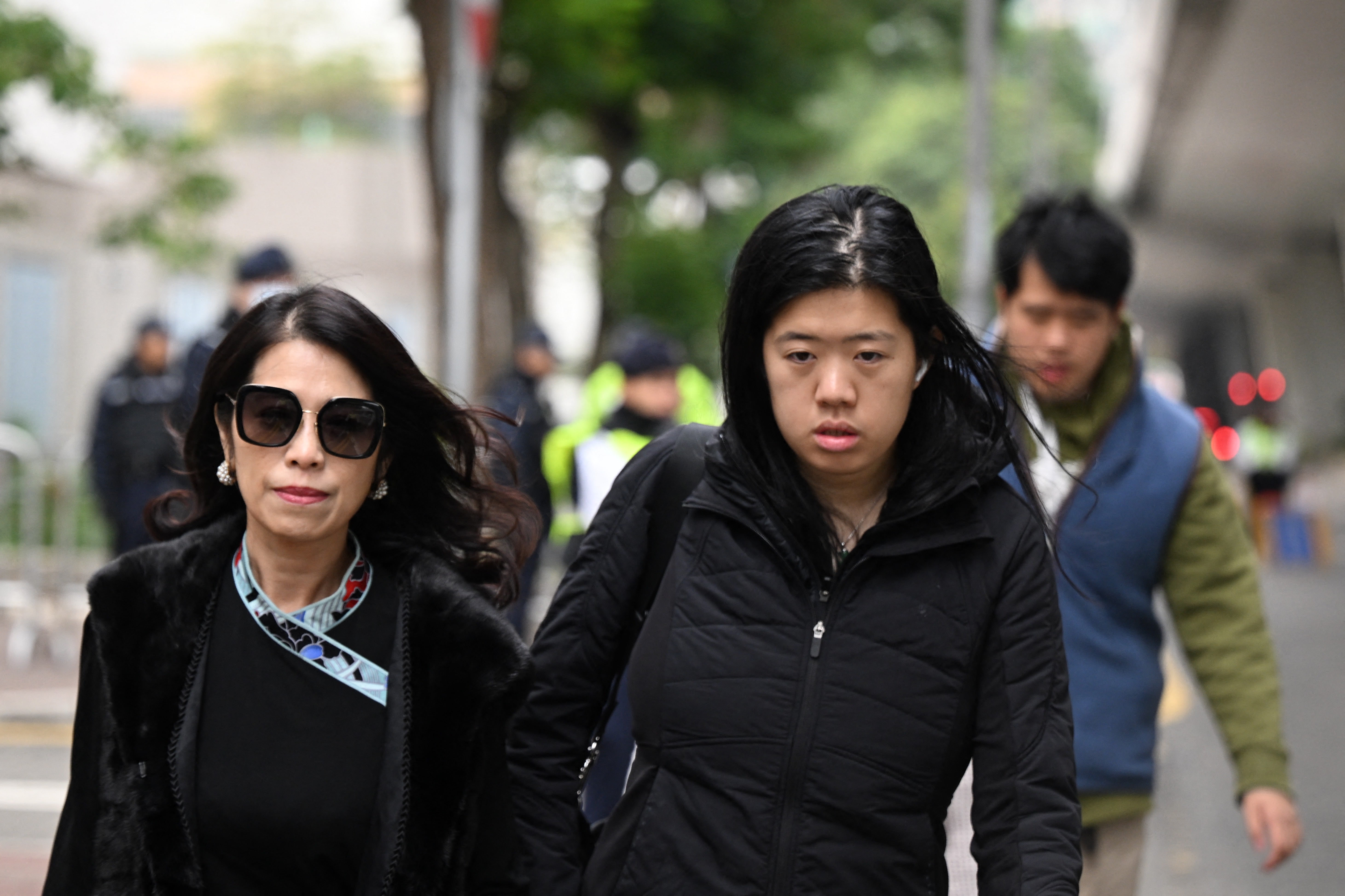 Teresa Lai (left), wife of Jimmy Lai, and their daughter Claire Lai Choi and son Lai Shun Yan arrive at the West Kowloon Court in Hong Kong