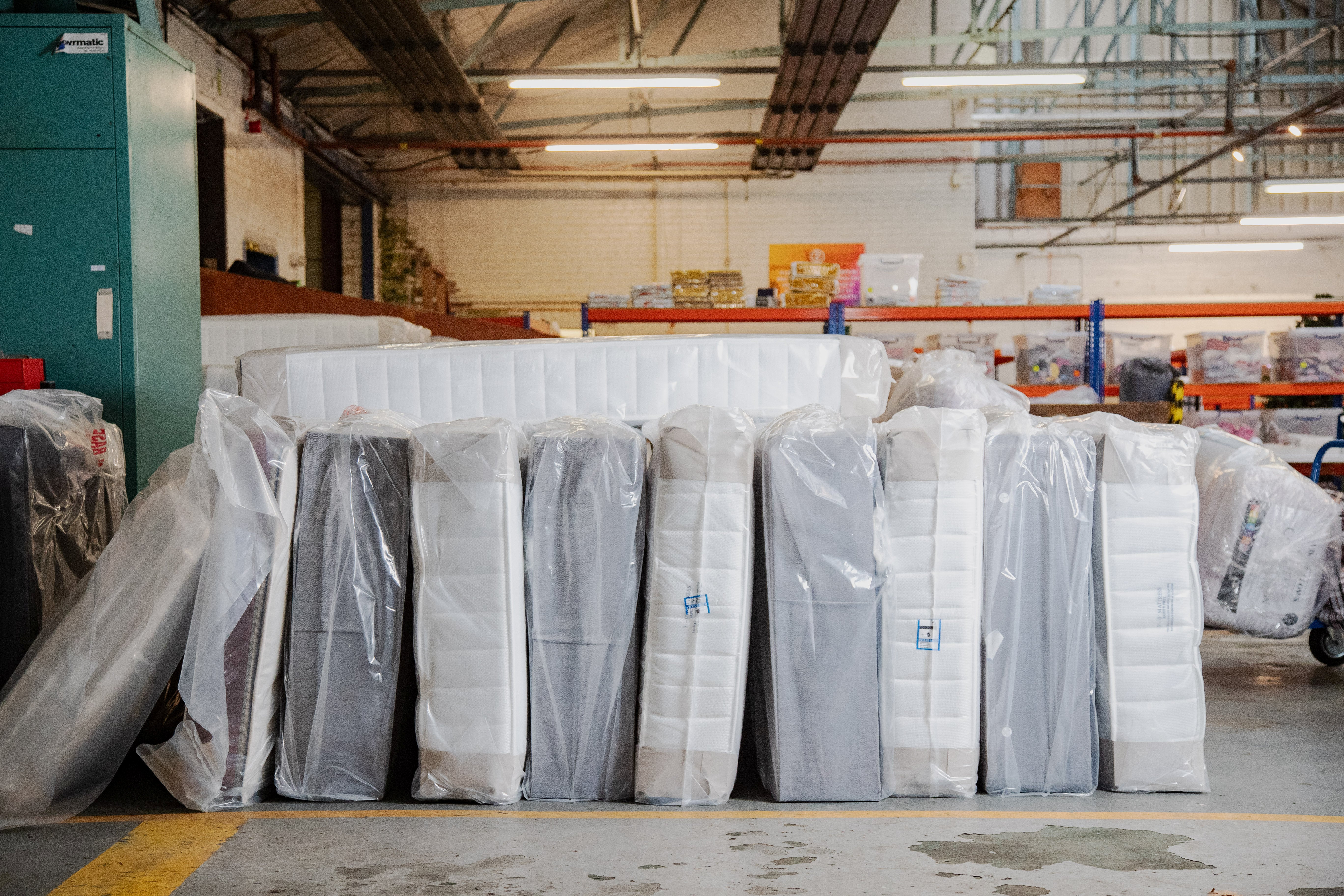 Mattresses are lined up, ready to be dispatched, at the Zarach charity’s headquarters