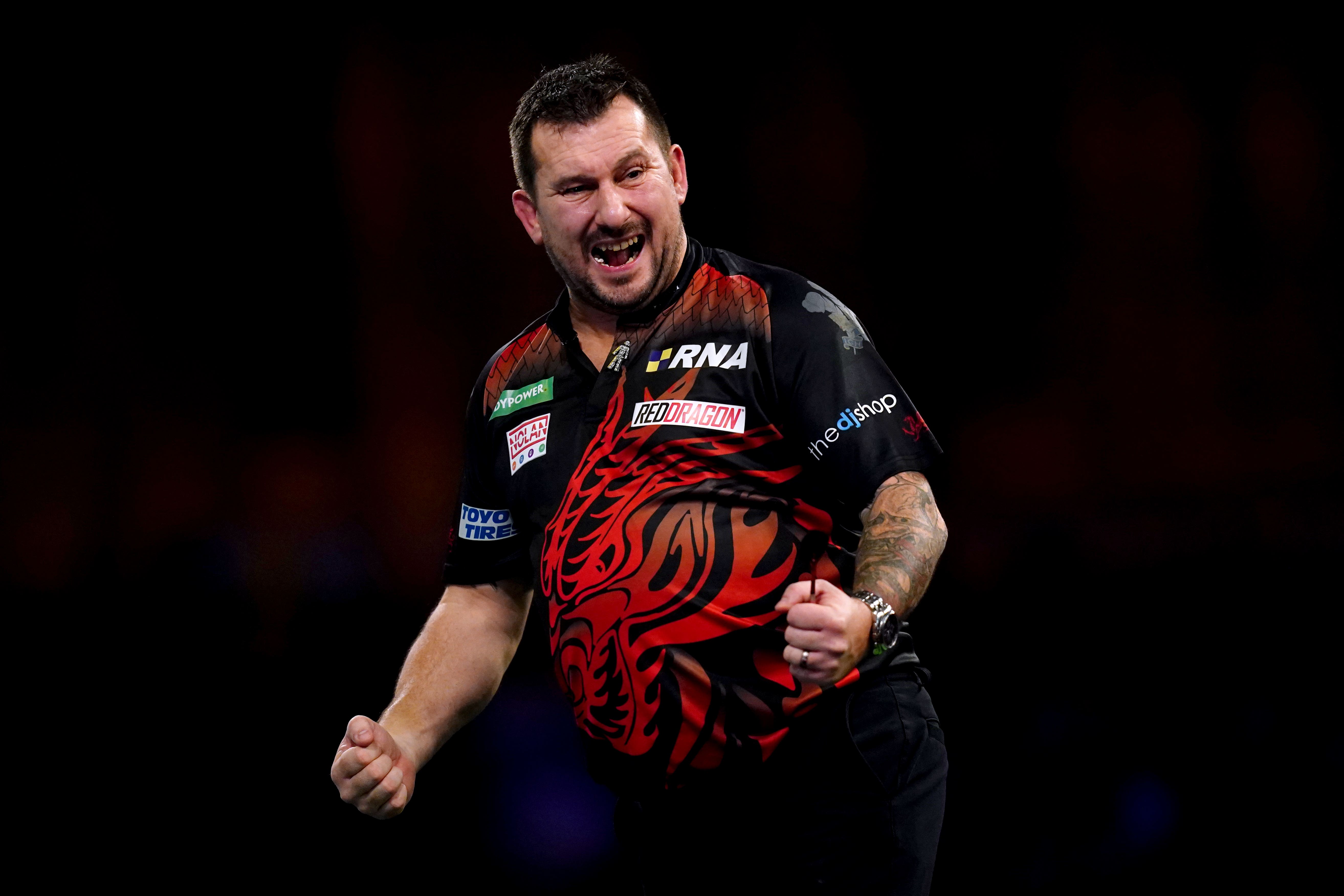 Jonny Clayton celebrates his win over Steve Lennon (John Walton/PA)