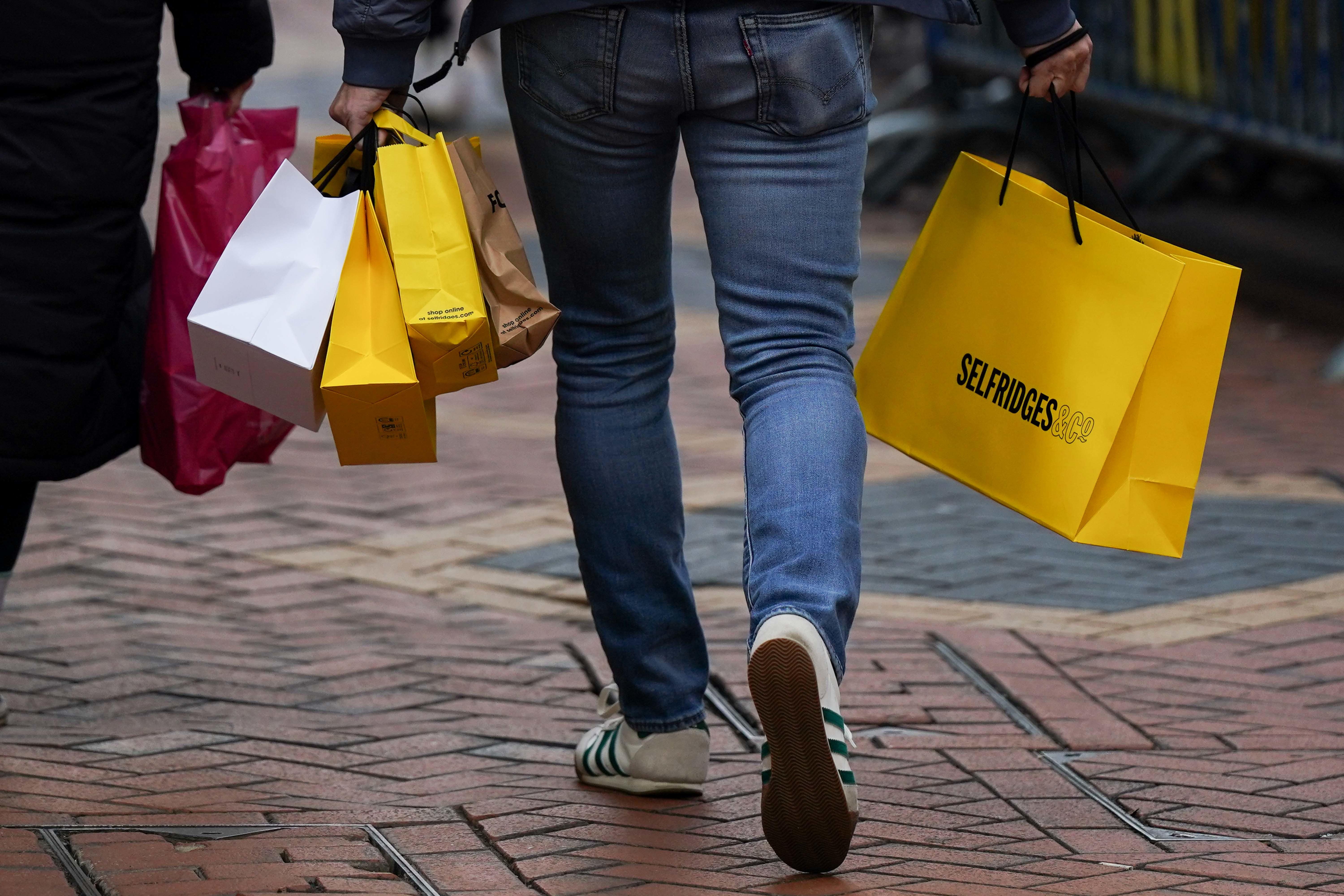 Shoppers walk along New Street in Birmingham, ahead of Christmas Day on Monday (Jacob King/PA)