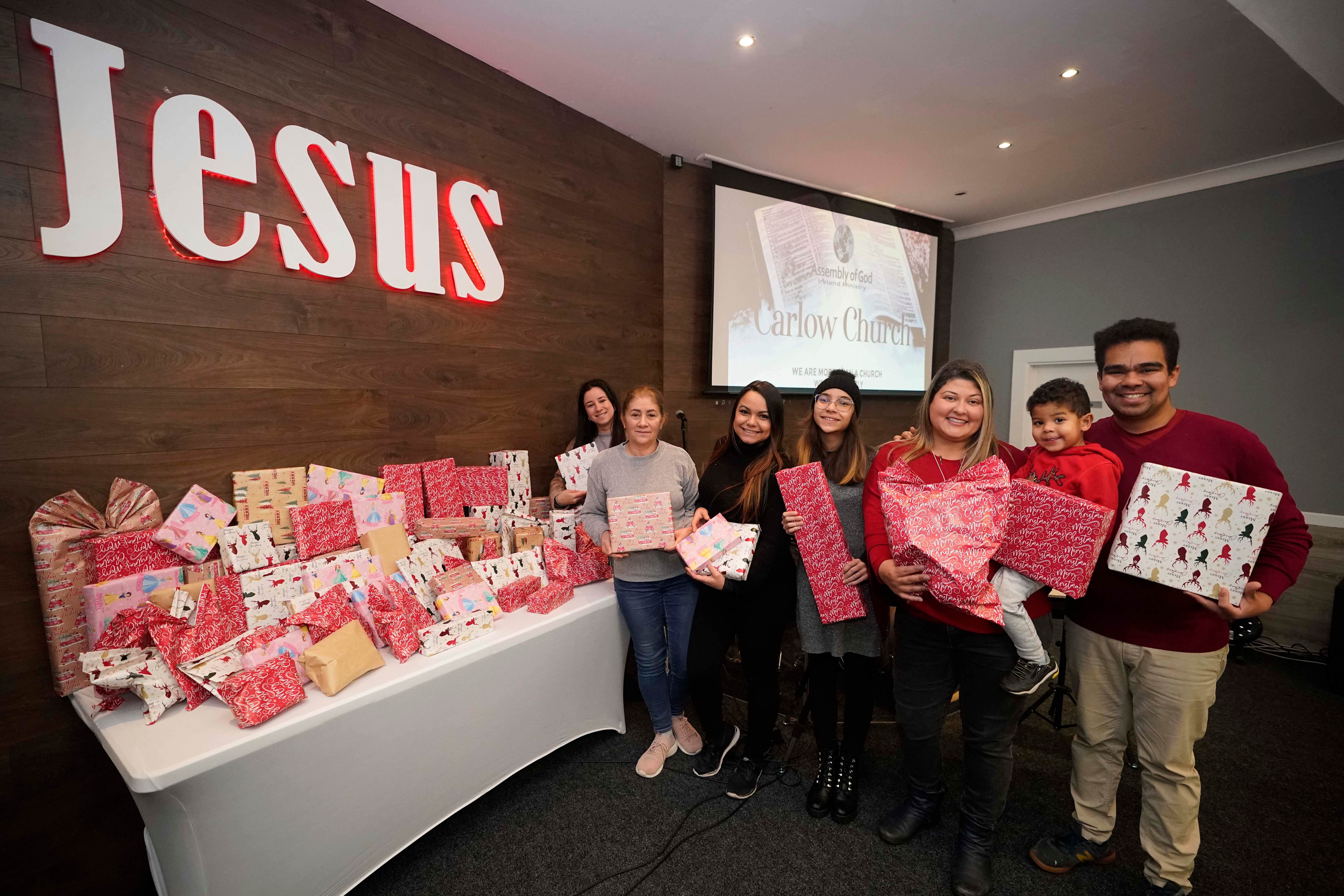 Members of the Assembly of God church in Carlow with some of the Christmas toys they have donated to Crumlin Children’s Hospital (Niall Carson/PA)