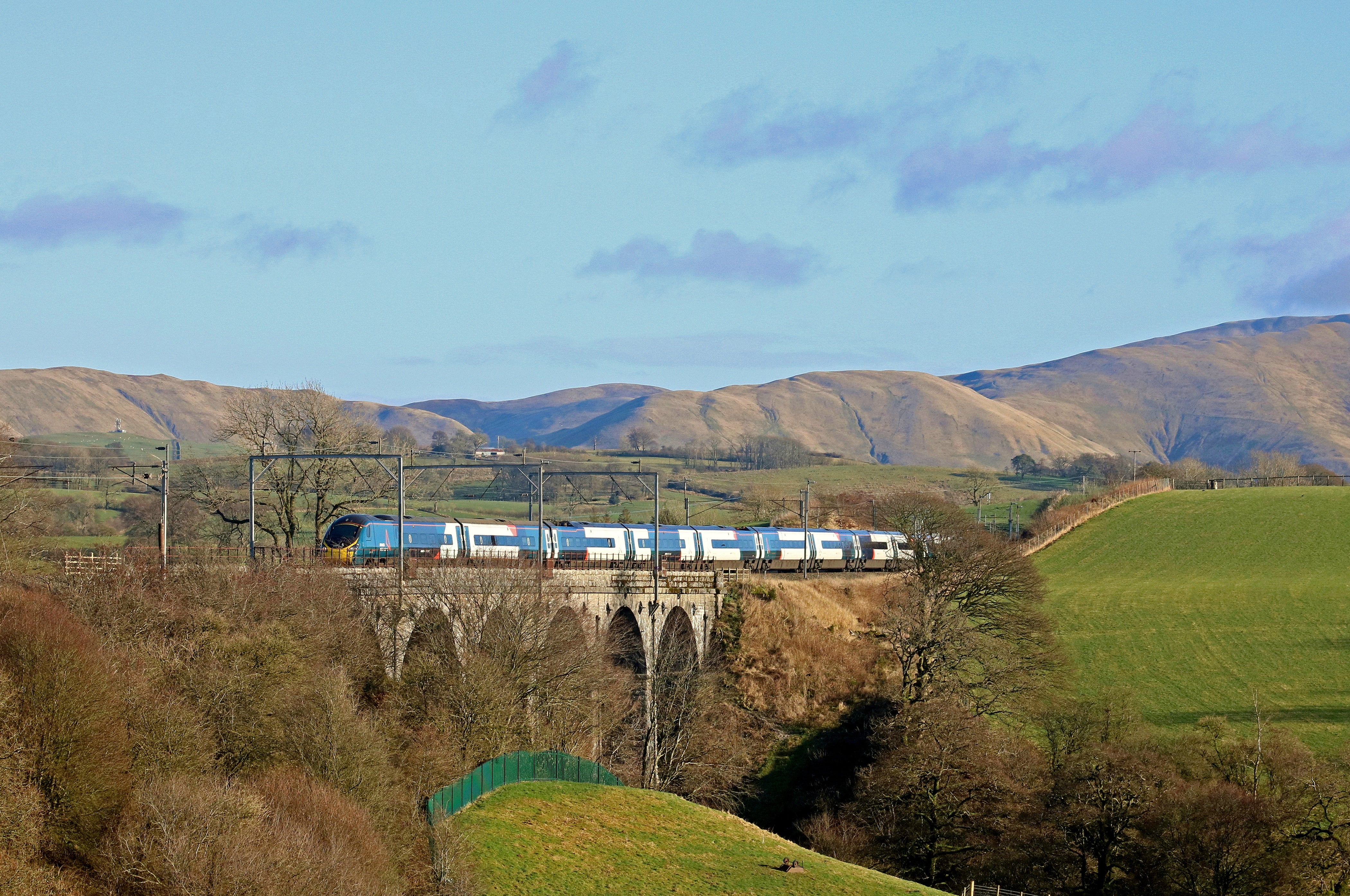 Avanti West Coast Pendolino 390155 passes over Docker Viaduct, with 1000 Glasgow Central to London Euston