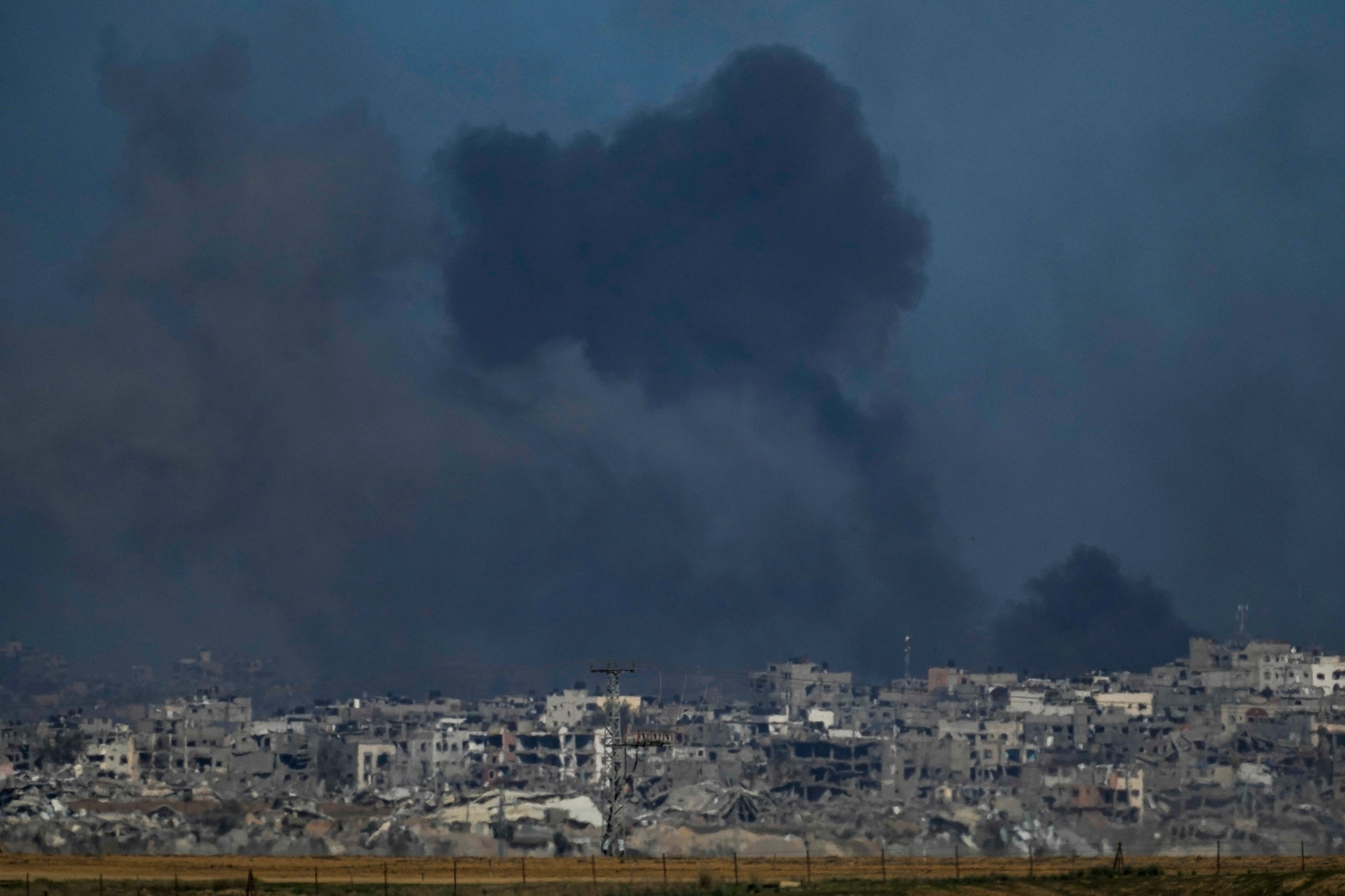 Smoke rises following an Israeli bombardment in the Gaza Strip, as seen from southern Israel, on Boxing Day