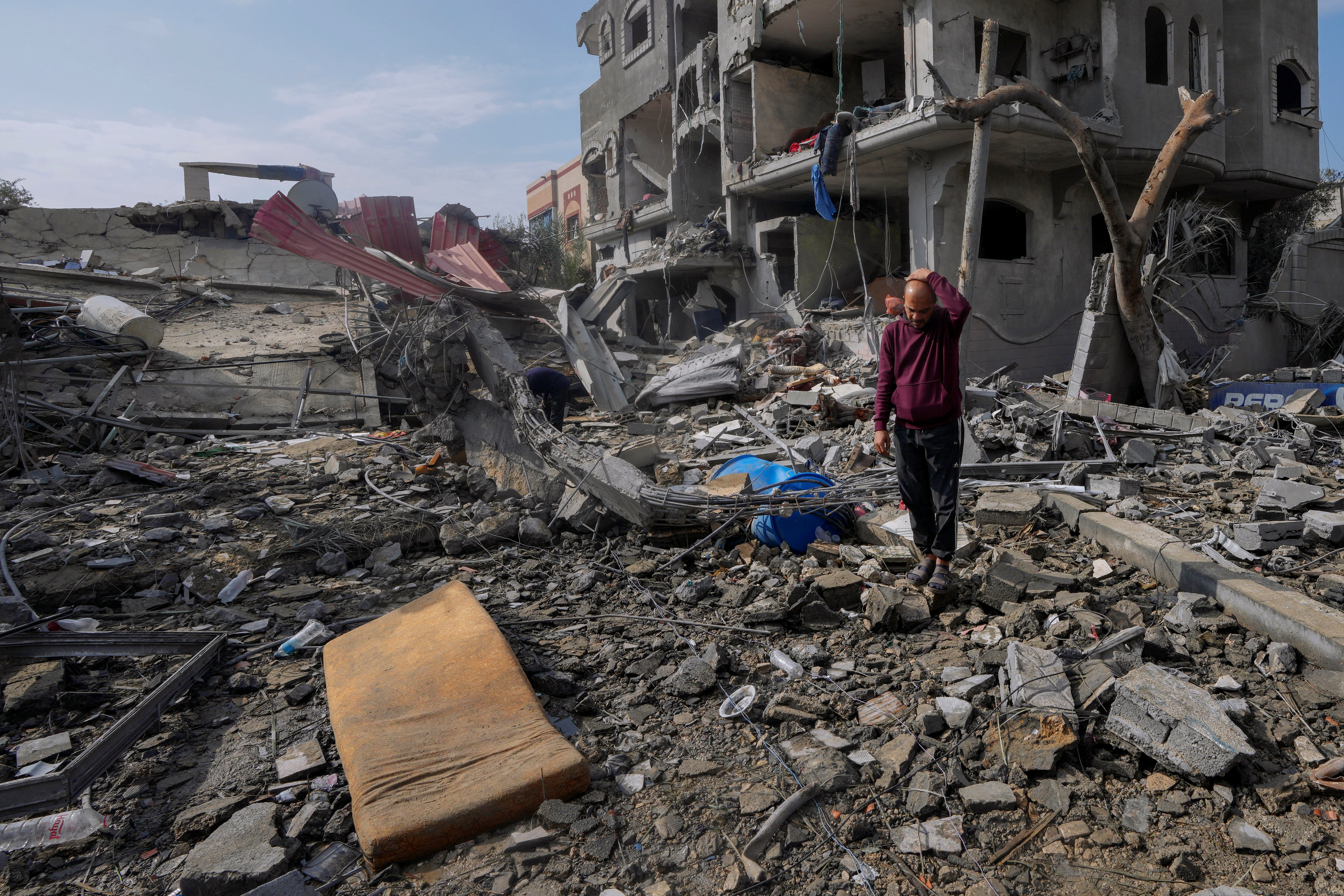 A man inspects the Al Nawasrah family’s destroyed building in Maghazi refugee camp, central Gaza