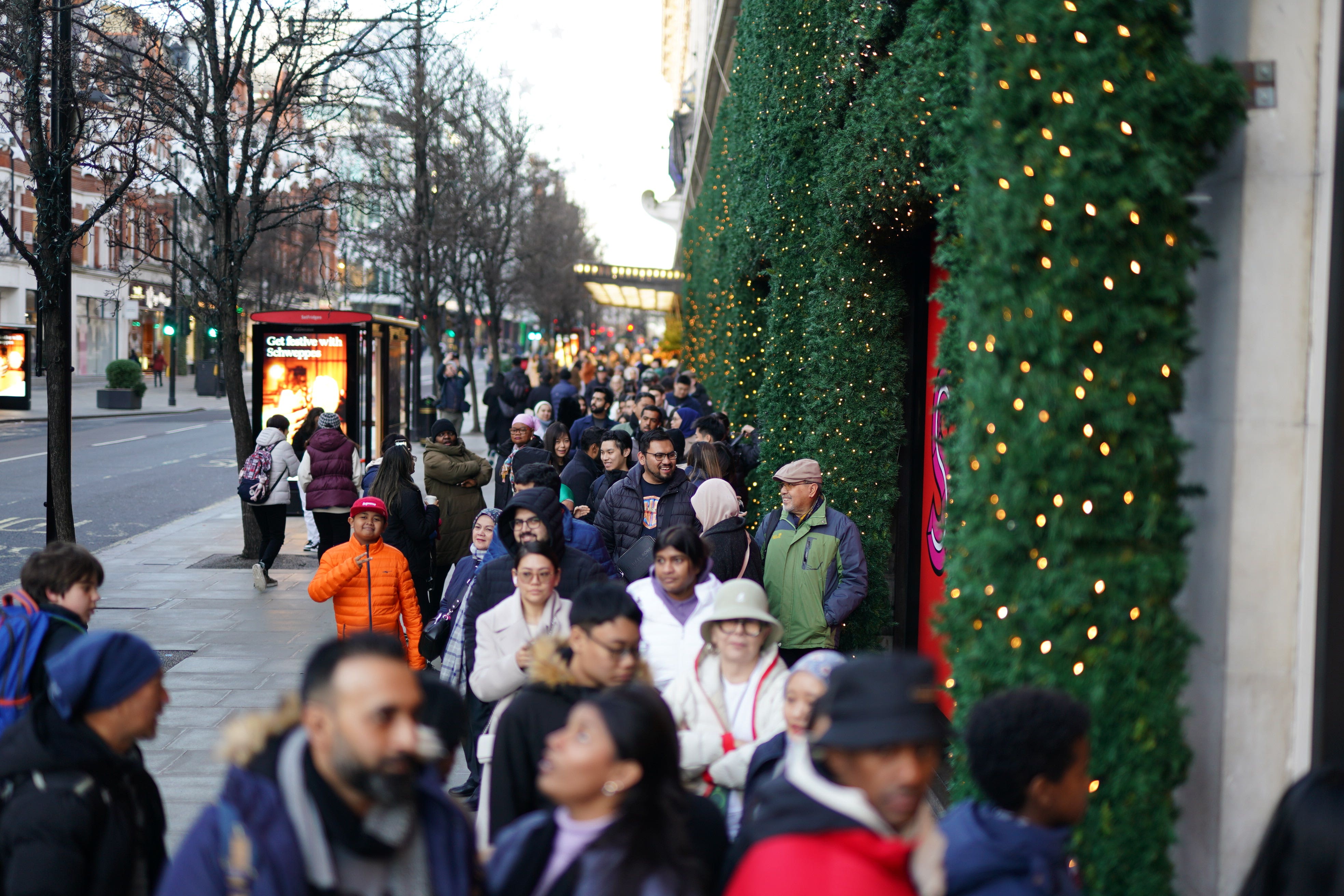 A line of shoppers outside Selfridges on Oxford Street (Jordan Pettitt/PA)