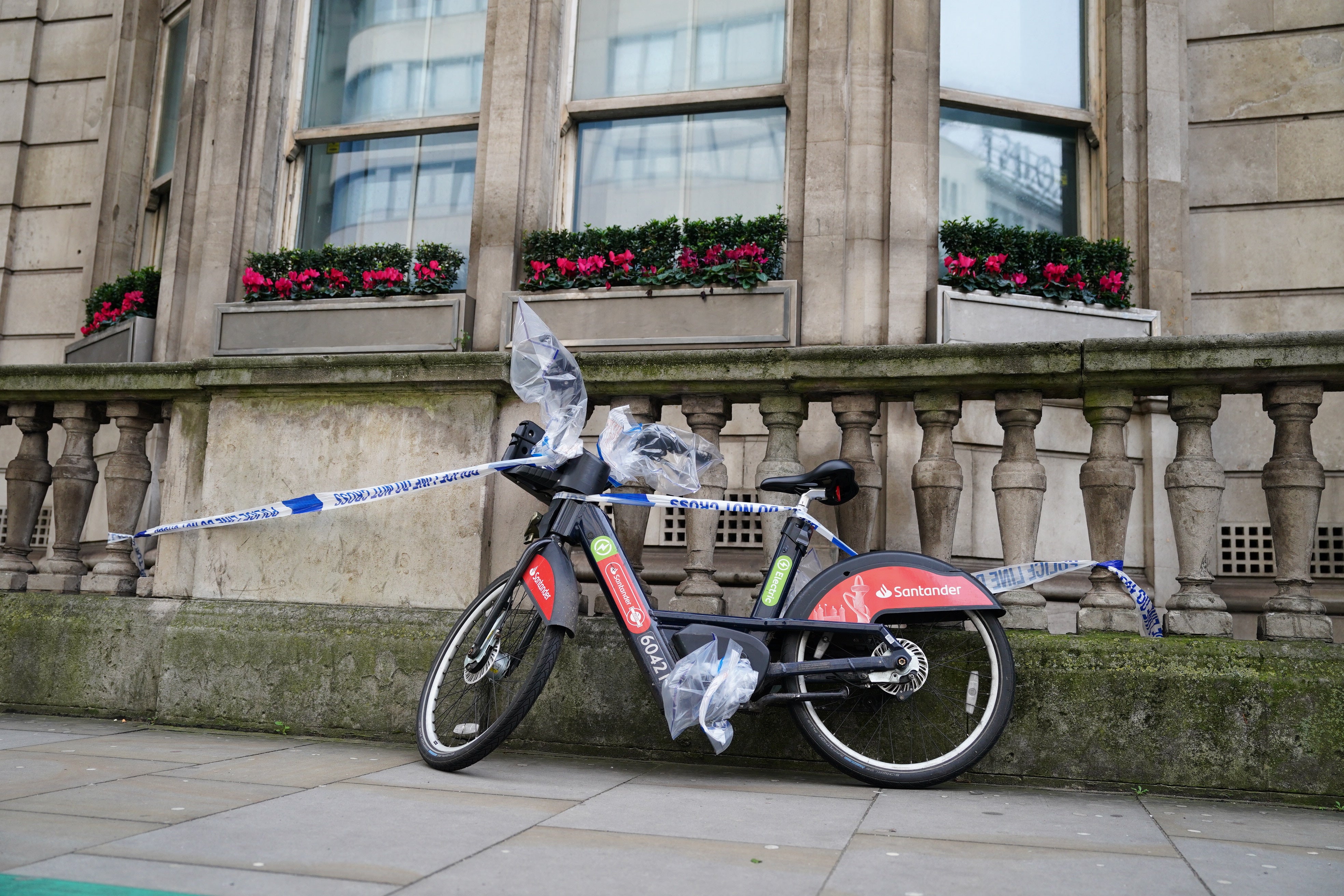 A Santander rental bike, with bags protecting potential evidence, on the A501 main road near to the scene at Cranwood Street