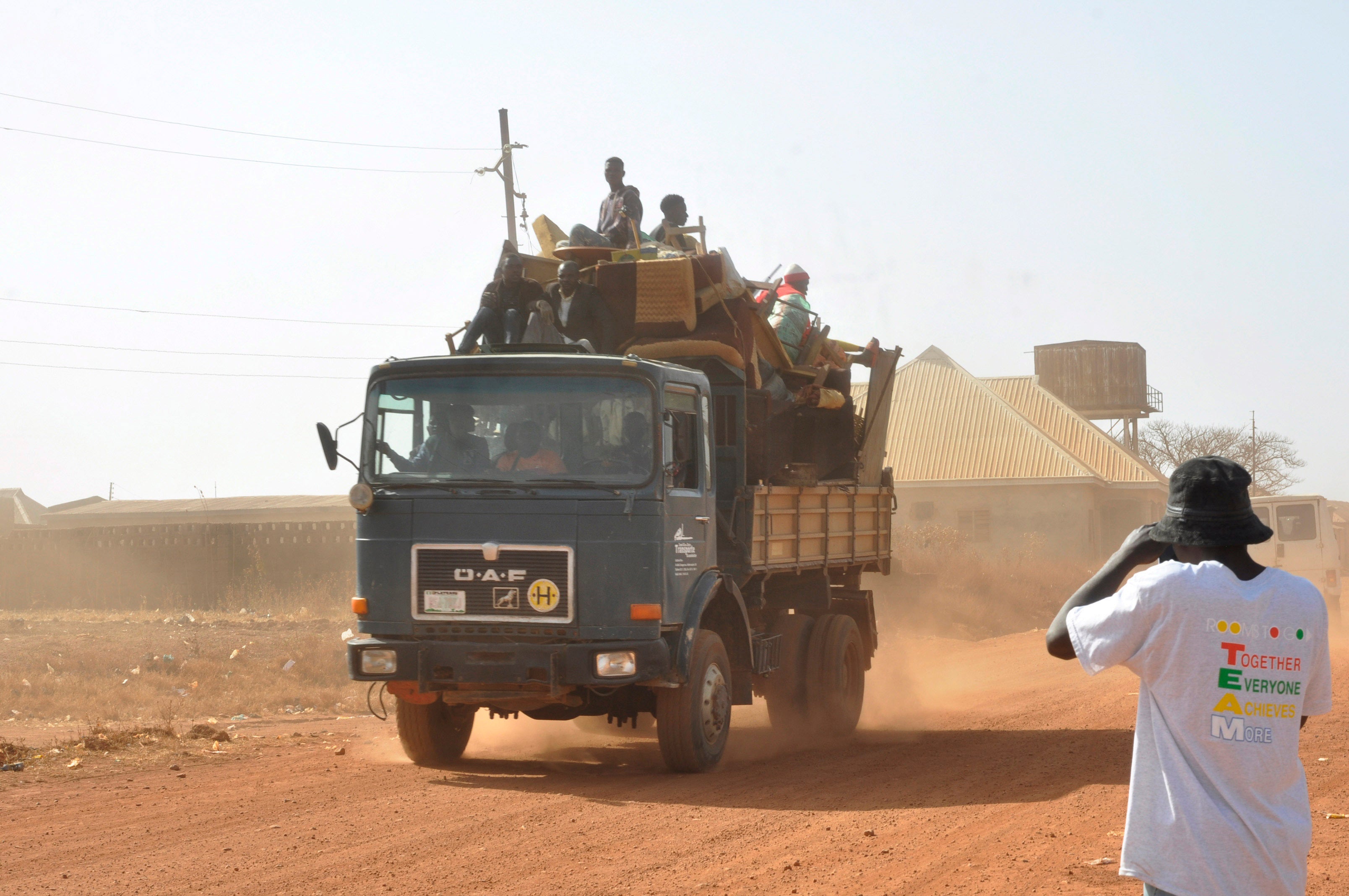 People flee following an attacked by gunmen in Bokkos, north central Nigeria, Tuesday, December 26, 2023