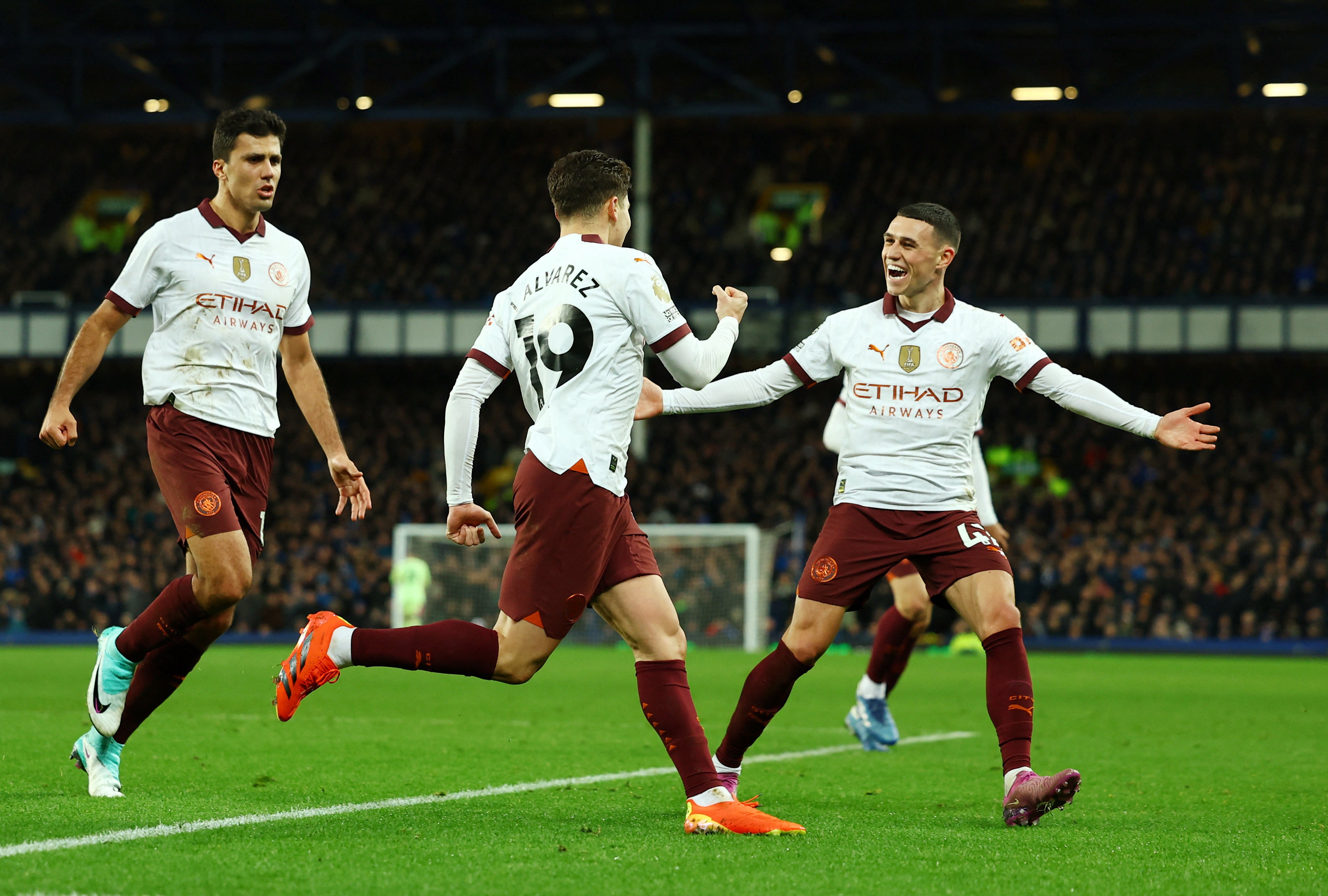 Phil Foden celebrates Julian Alvarez’s second-half penalty