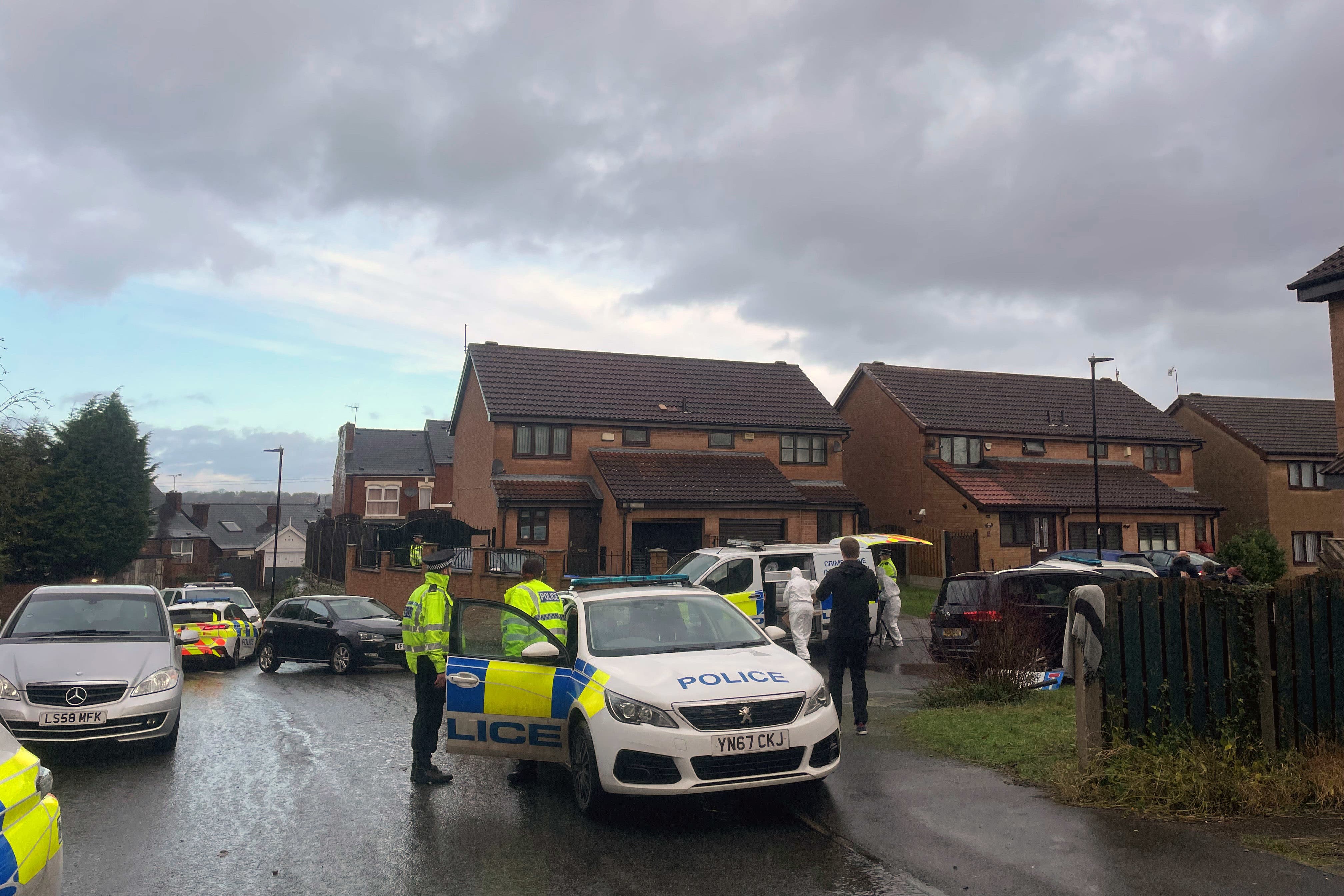 Police officers at the scene at College Court after a 46-year-old man died and several others were injured (Dave Higgens/PA)