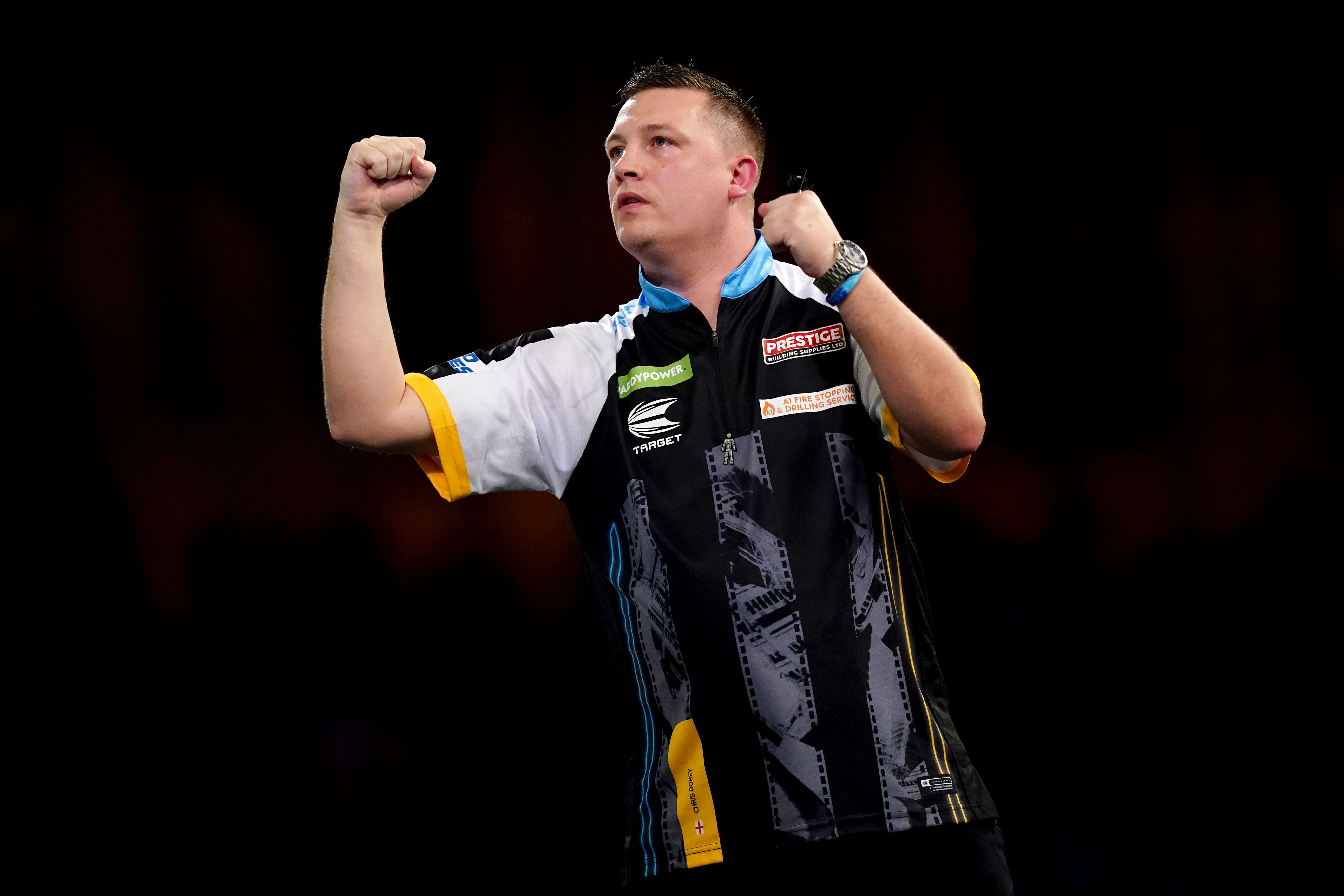 Chris Dobey defeated Ross Smith in the World Darts Championship (John Walton/PA)