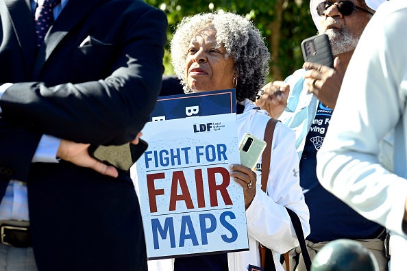 Demonstrators attend a rally outside of the US Supreme Court on 11 October.