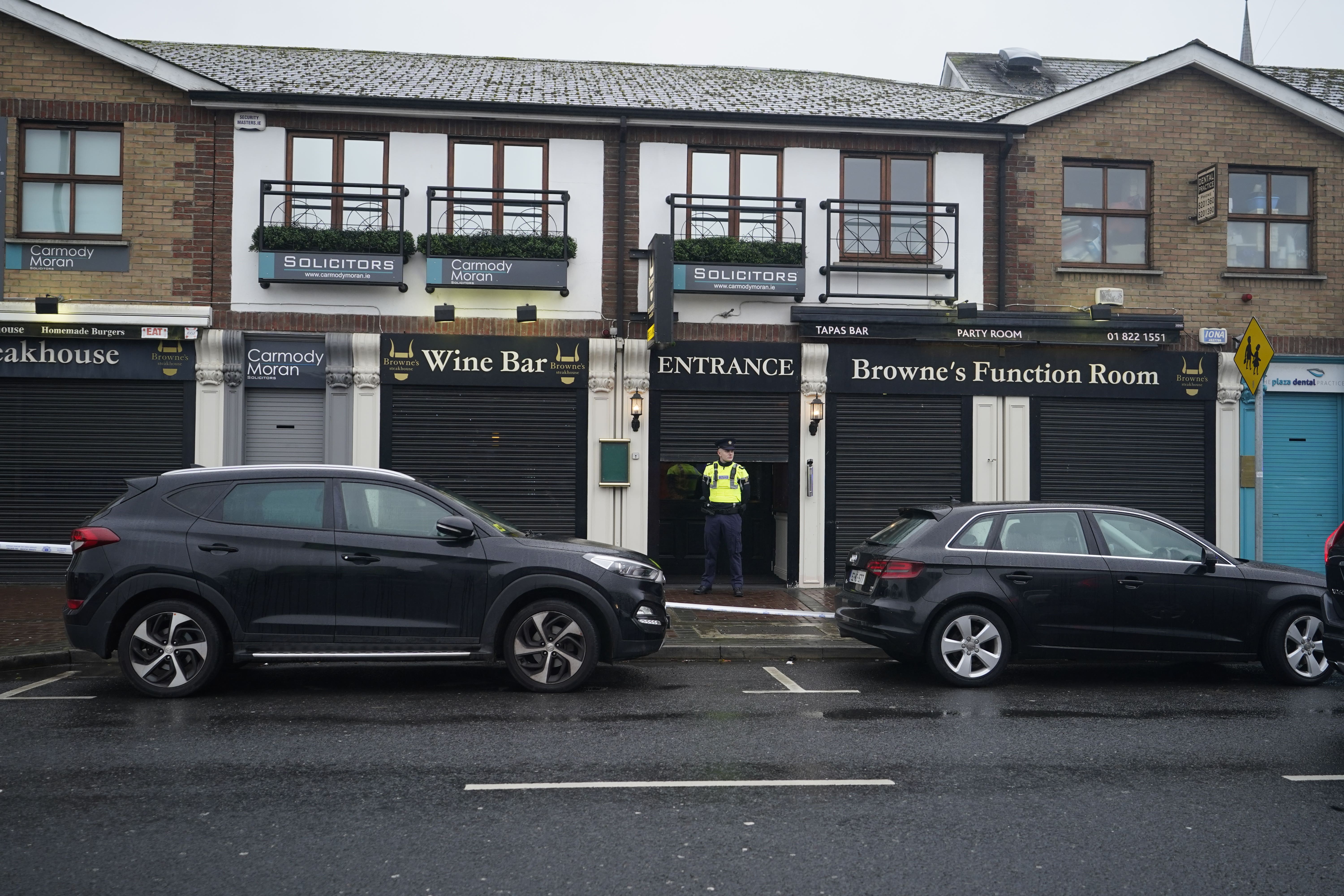 Garda officers at the scene in Blanchardstown where a man aged in his 20s was pronounced dead after being injured during a shooting incident (Niall Carson/PA)