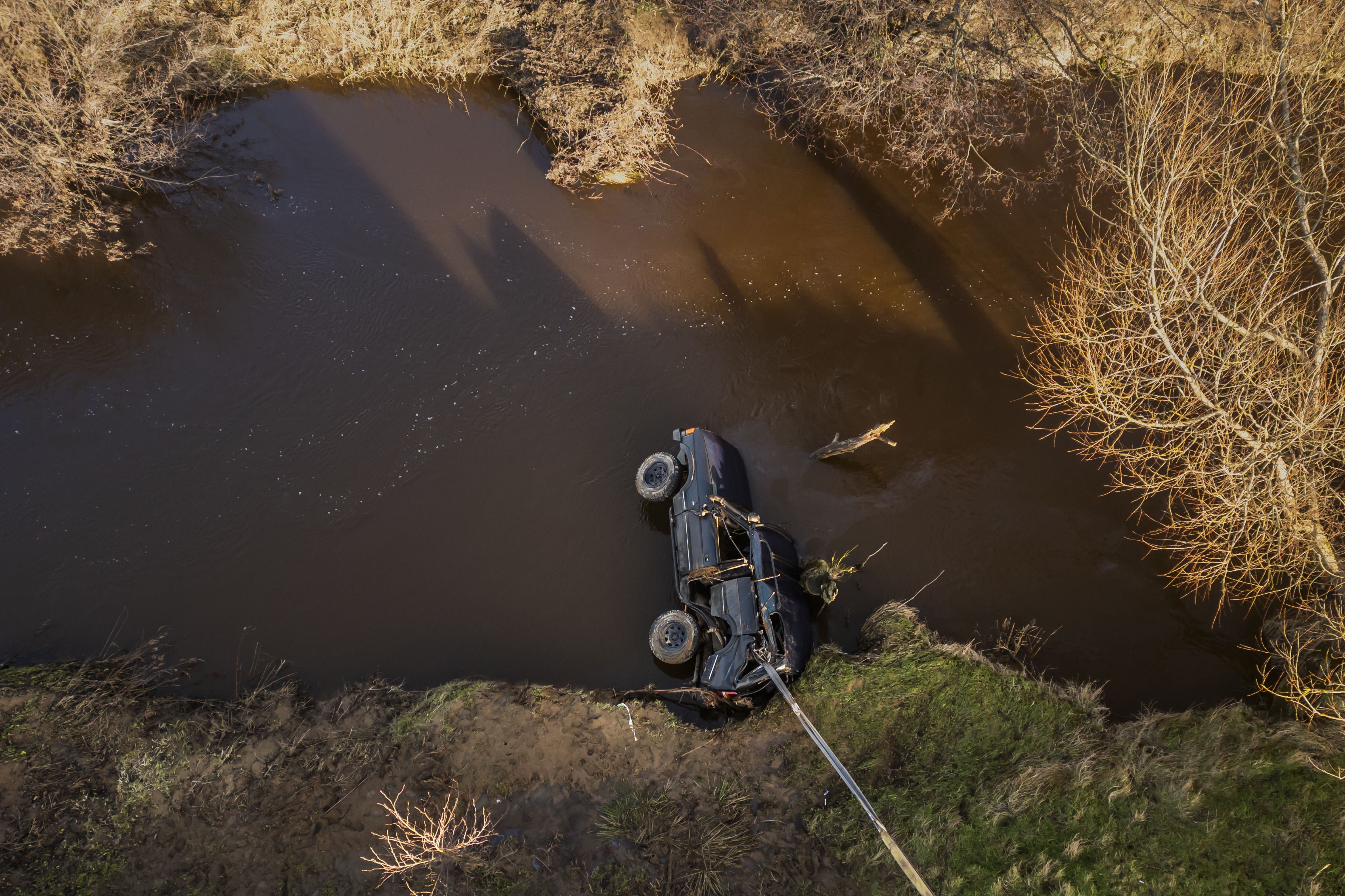 The recovered vehicle being removed from the River Esk near Glaisdale, North Yorkshire (Danny Lawson/PA)