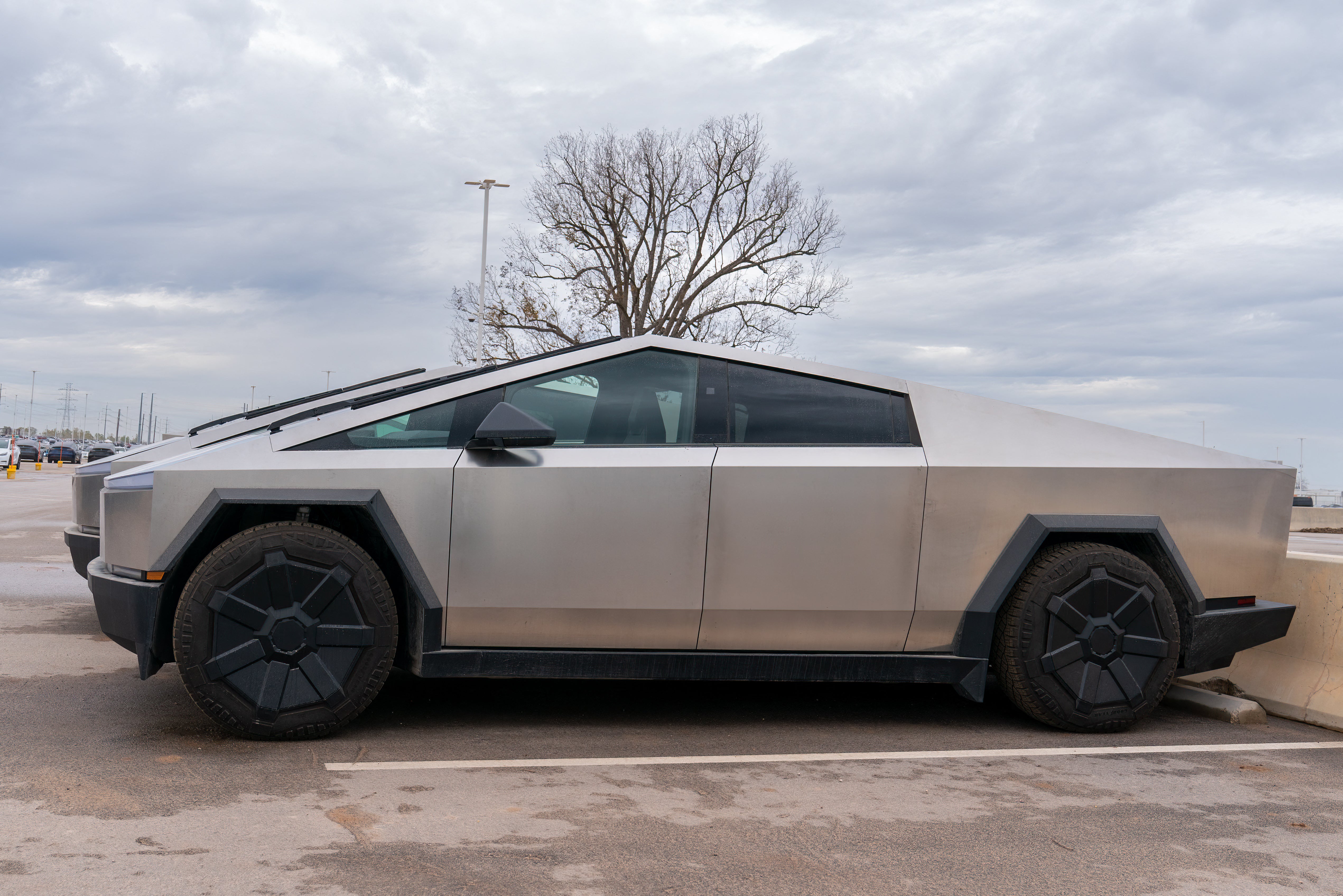 Newly manufactured Tesla Cybertrucks are parked outside the company’s Giga Texas factory