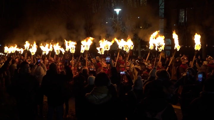 Thousands of torches lit Edinburgh streets on Friday to kick off Hogmanay celebrations.