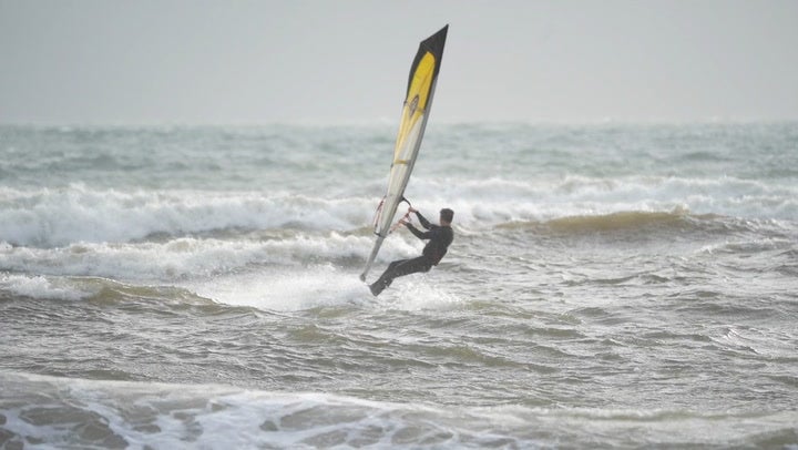 Some have taken to the sea to take advantage of the high winds, including here on Avon Beach in Christchurch, Dorset