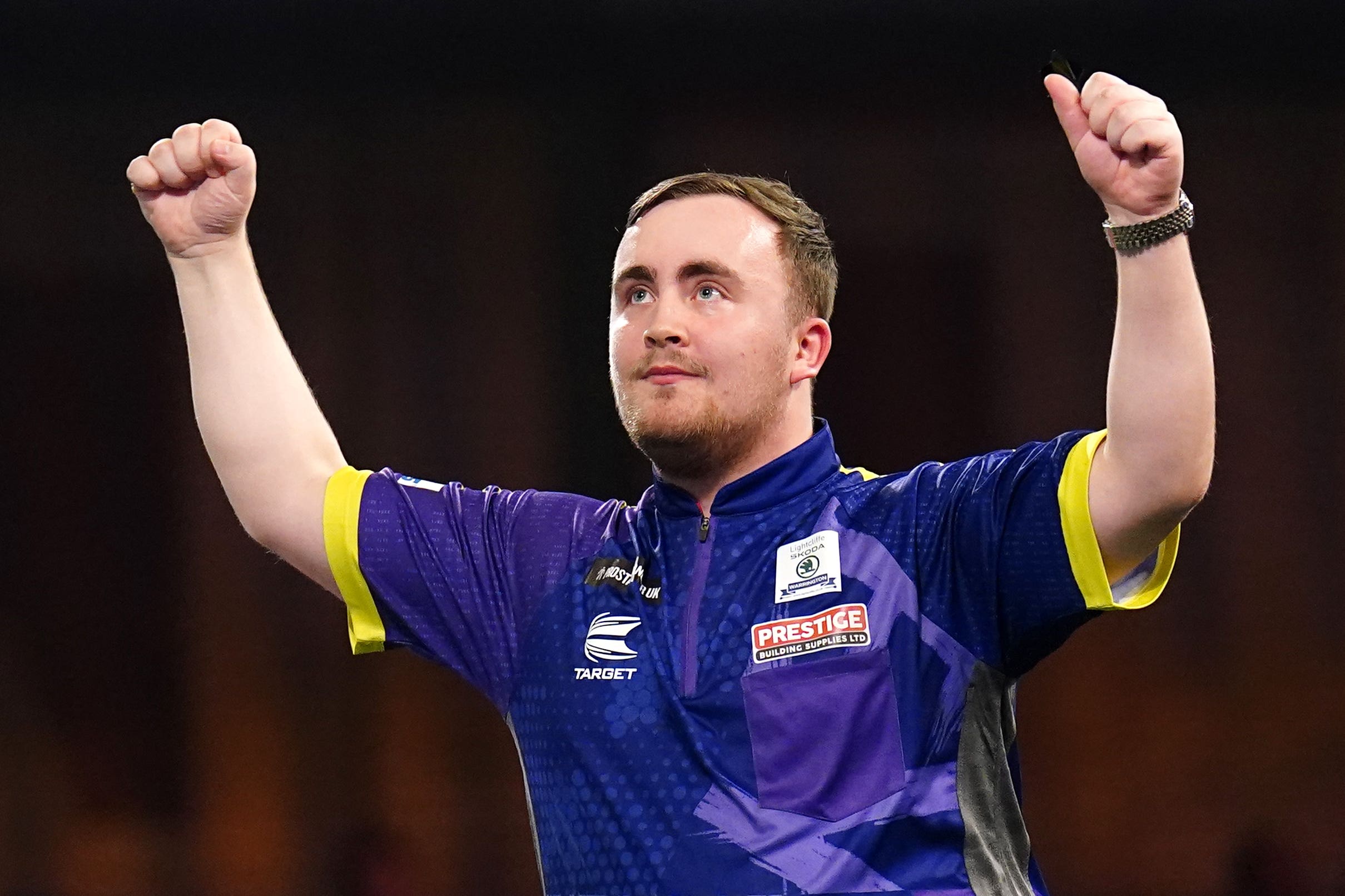 Luke Littler celebrates victory over Raymond van Barneveld (Zac Goodwin/PA)