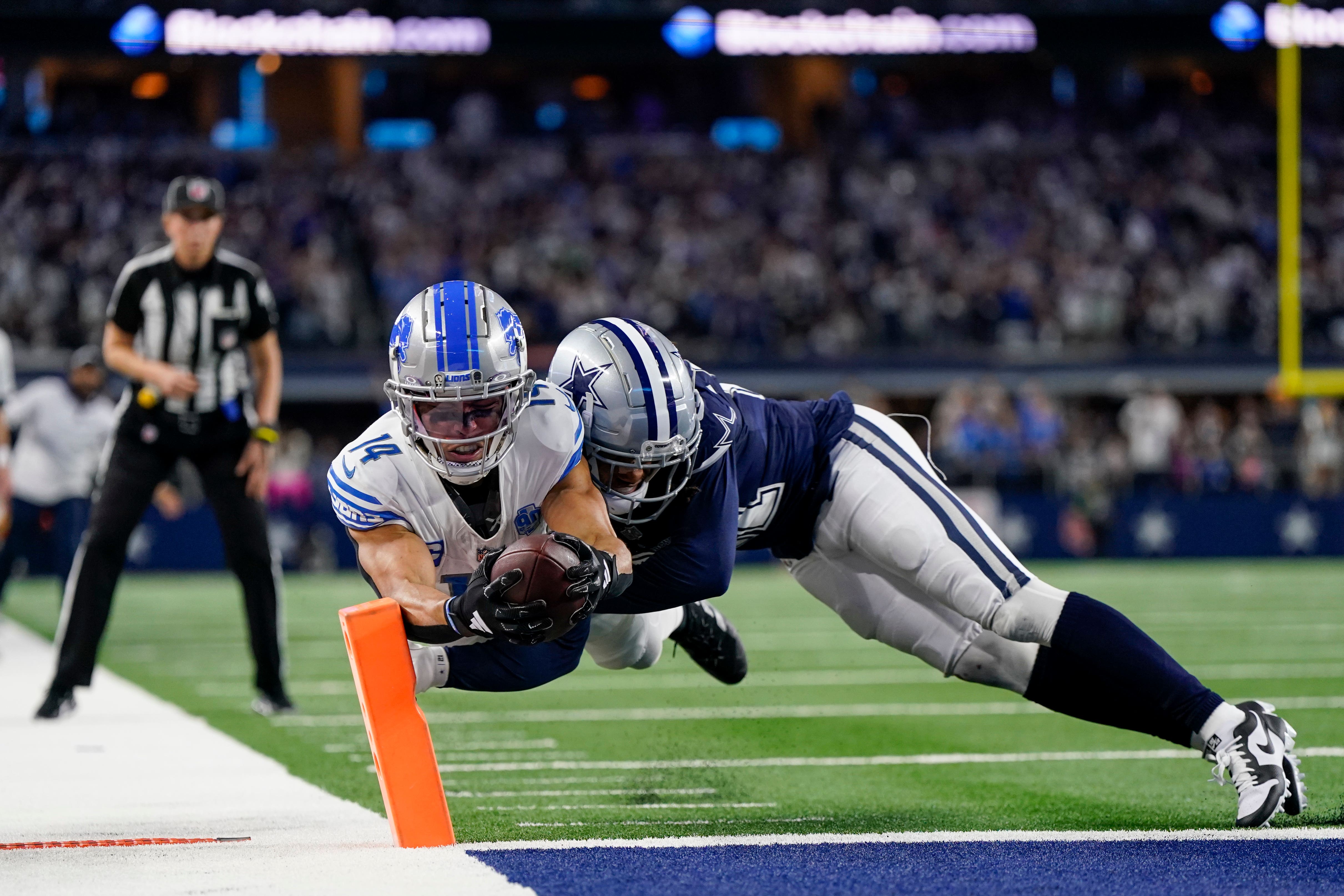 Detroit Lions wide receiver Amon-Ra St Brown scores a touchdown as Dallas Cowboys cornerback Stephon Gilmore tries to stop him (Sam Hodde/AP)