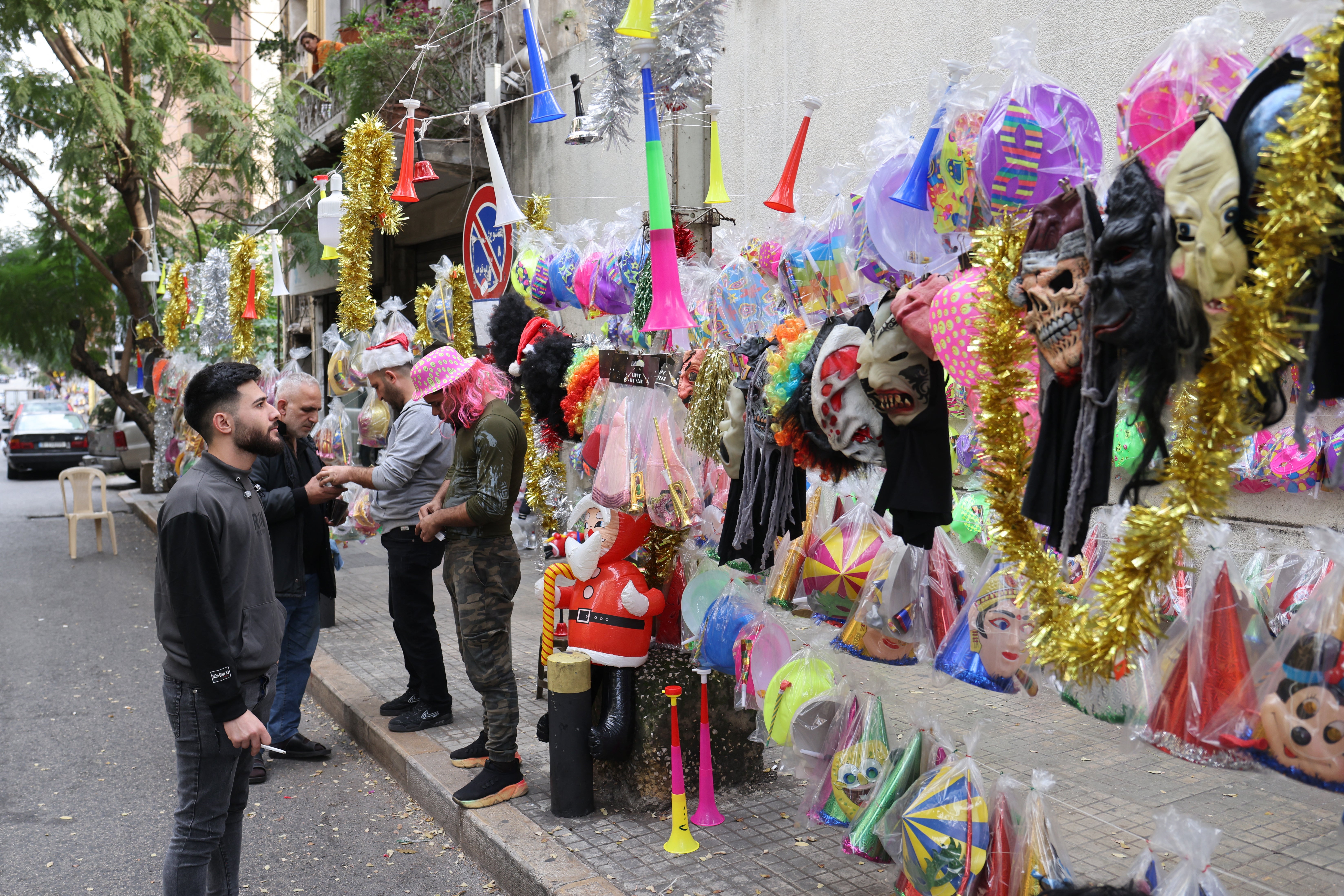 A street vendor sells festive party novelties for New Year's Eve in Beirut