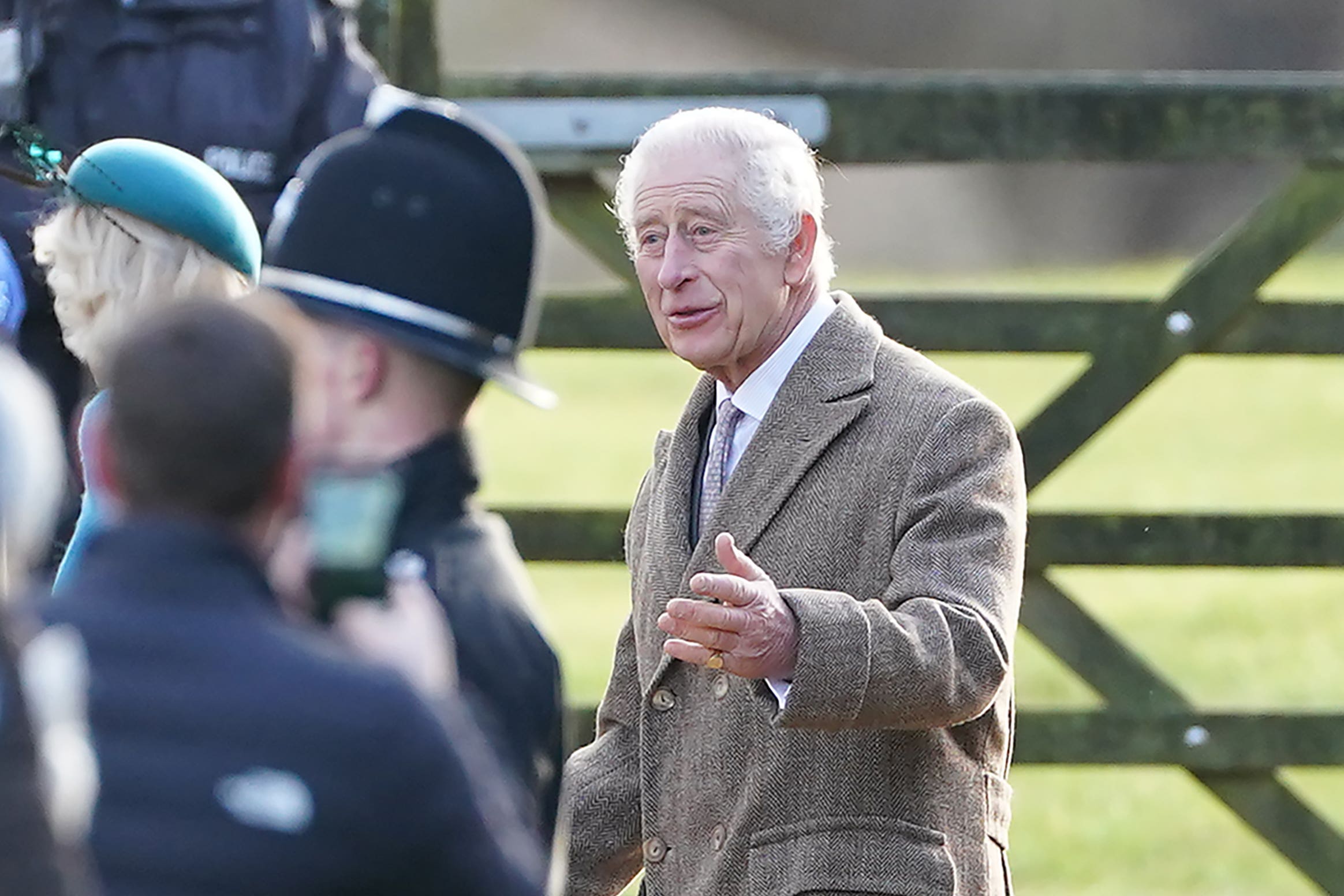 The King greets members of the public as they leave a morning church service at St Mary Magdalene Church in Sandringham (PA)