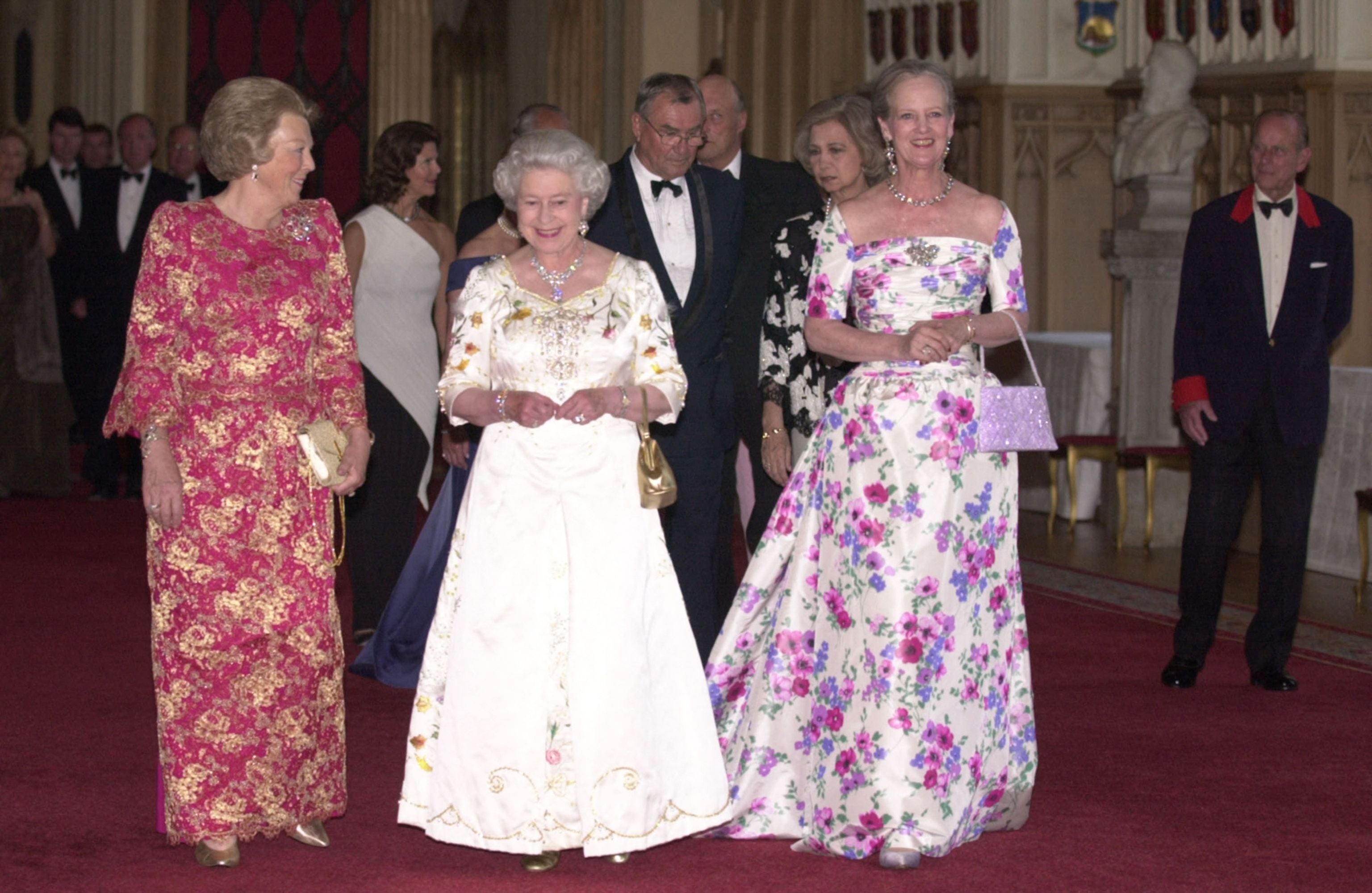 Queen Beatrix of Holland, Queen Elizabeth II and Queen Margrethe II attend a dinner at Windsor Castle in 2002