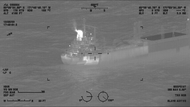 The cargo vessel, pictured above by the US Coast Guard, was docked 2 miles off the Alaskan coast as responders attended to the fire