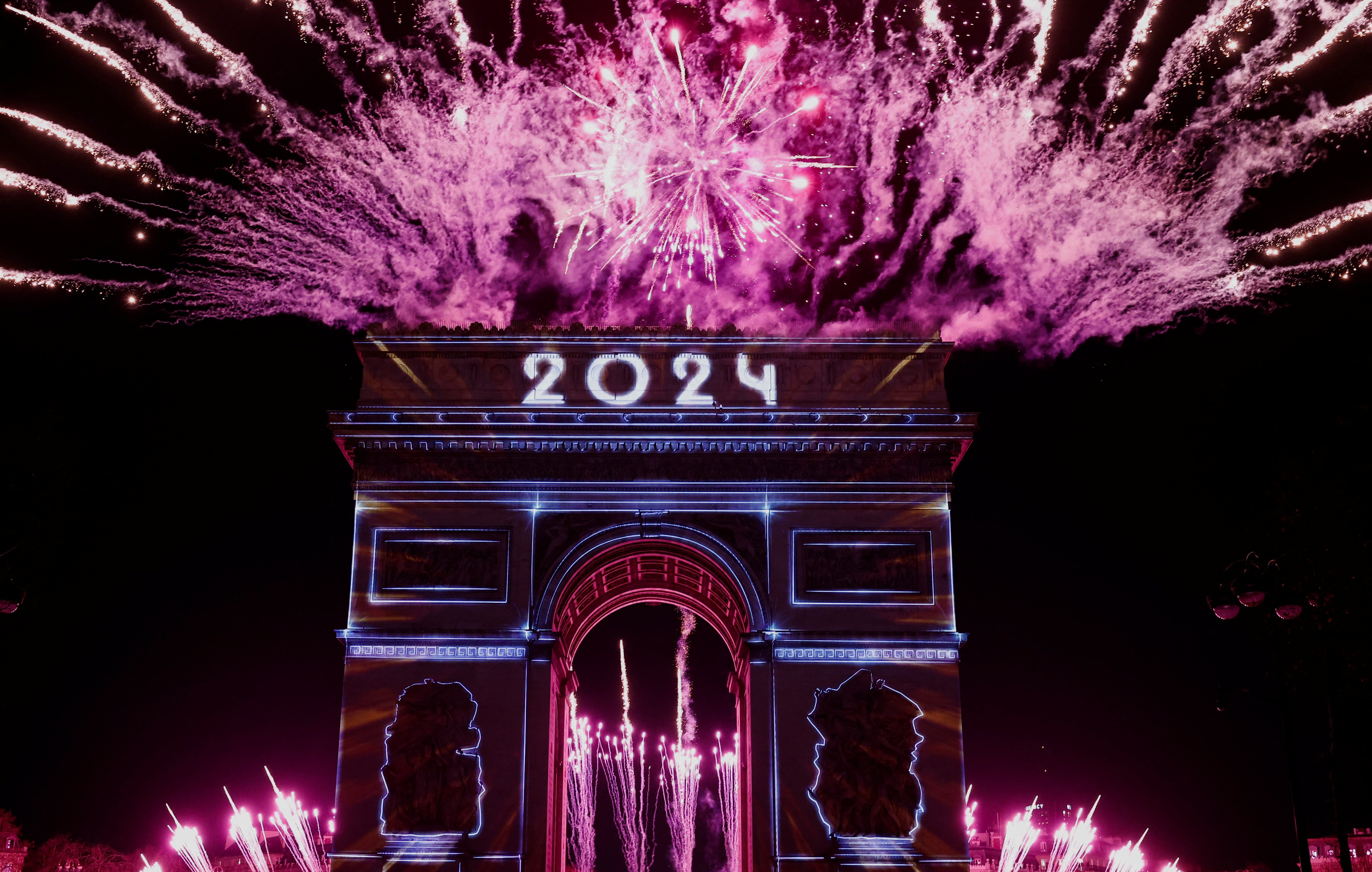 The Arc de Triomphe is lit up during the New Year’s celebration