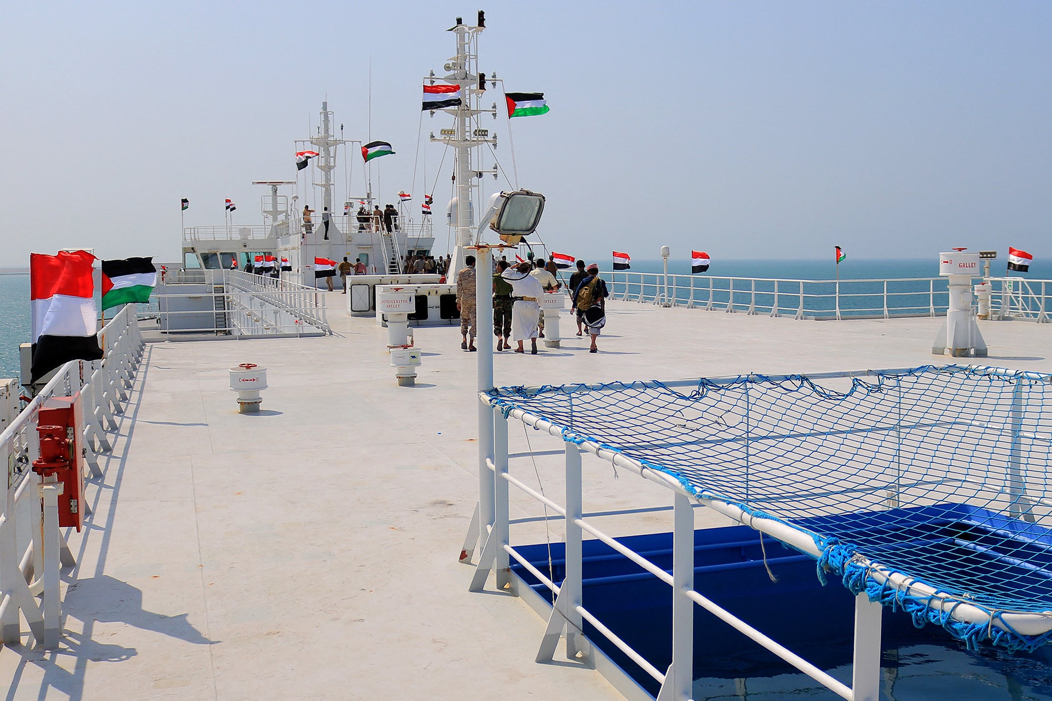 A picture taken during an organised tour by Yemen's Houthi rebels (on board) on November 22, 2023 shows the Galaxy Leader cargo ship, seized by Houthi fighters